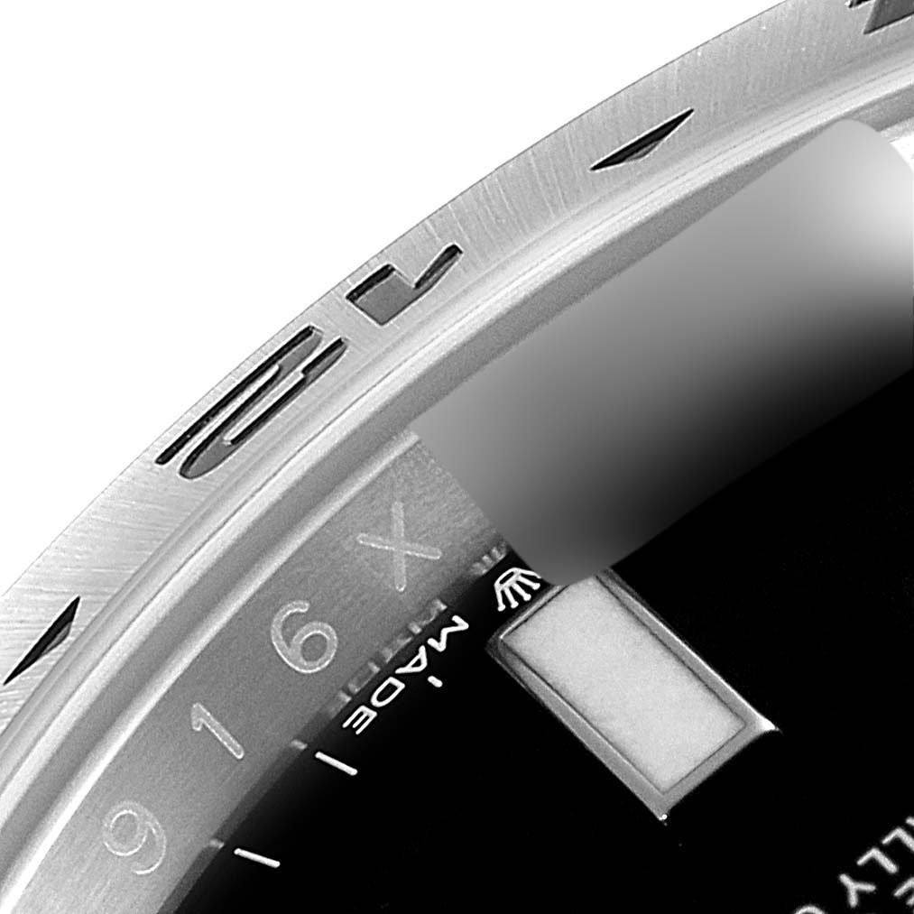 This image shows a close-up of the bezel and part of the dial of the Rolex Explorer 226570 Men's Stainless Steel Black Dial 226570 Men's Stainless Steel Black Dial watch.