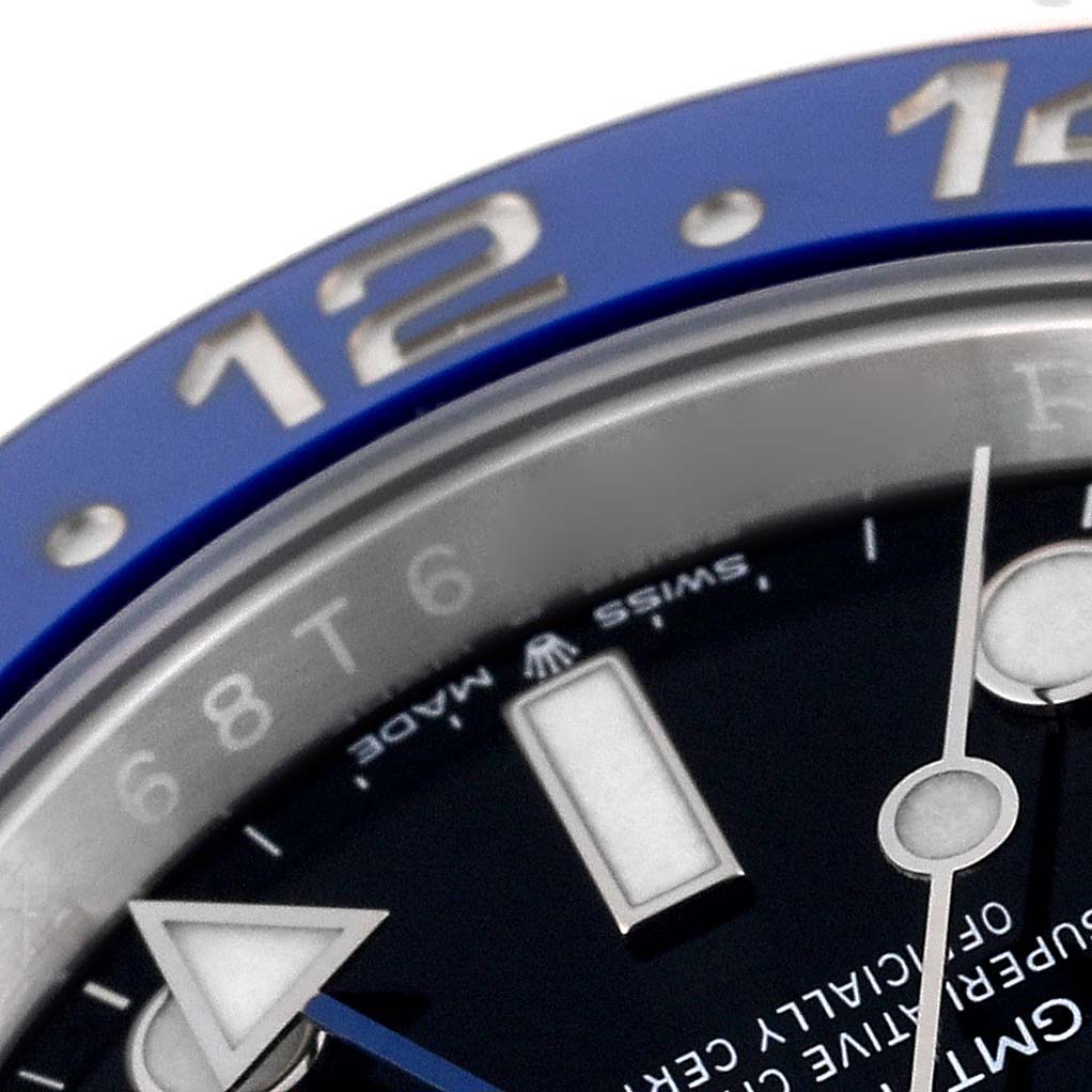 This close-up shows the bezel, part of the dial, and hands of the Rolex GMT-Master 126710 Men
s Stainless Steel Black Dial 126710 Men
s Stainless Steel Black Dial watch.