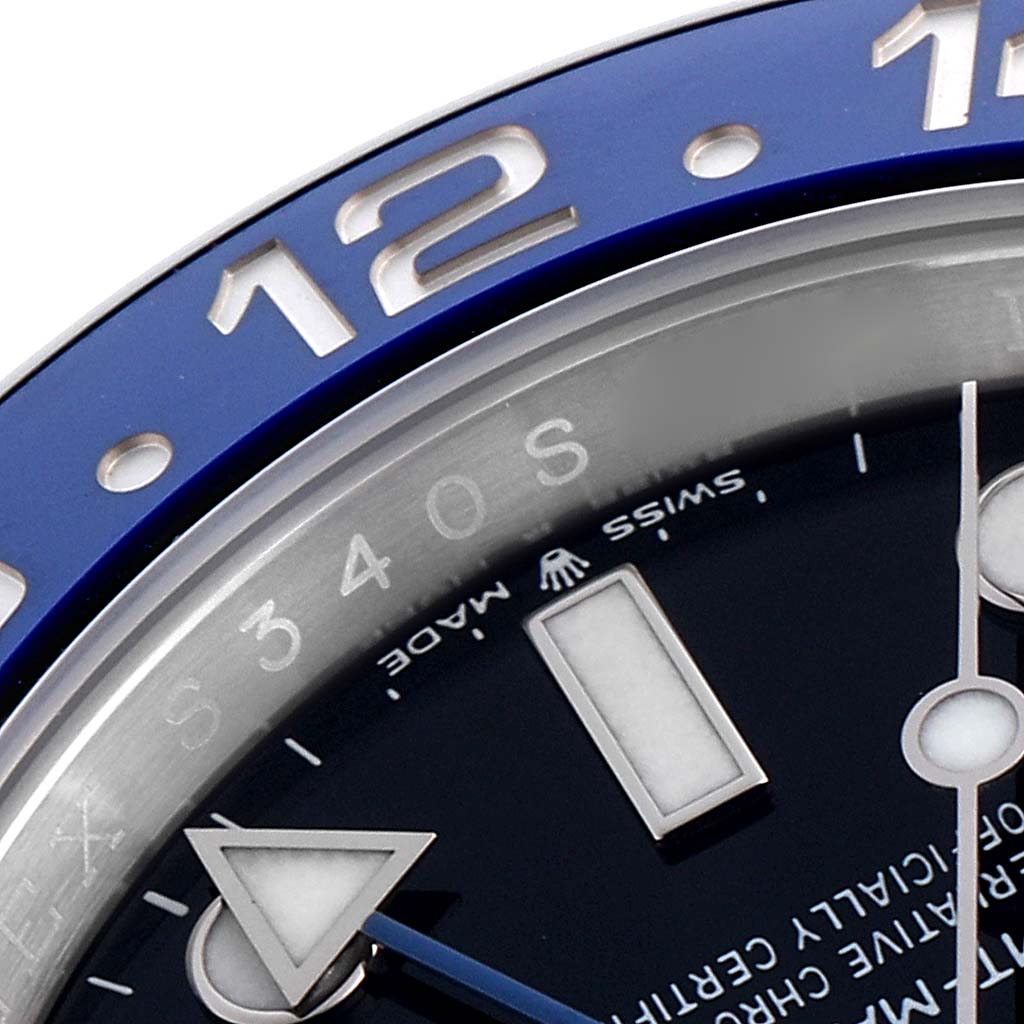 This close-up of the Rolex GMT-Master 126710 Men
s Stainless Steel Black Dial 126710 Men
s Stainless Steel Black Dial shows the bezel edge with "12," partial dial, and hour markers.
