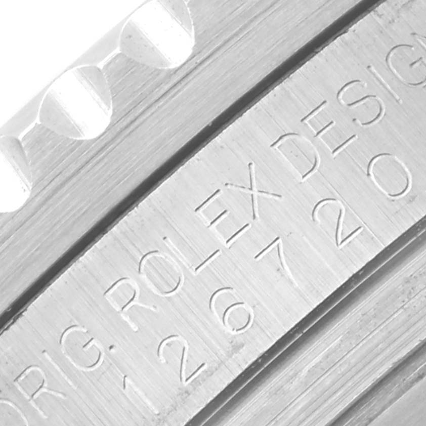 The image shows a close-up of the engraved bezel and side of a Rolex GMT-Master 126720VTNR Men's Stainless Steel Black Dial 126720VTNR Men's Stainless Steel Black Dial watch.