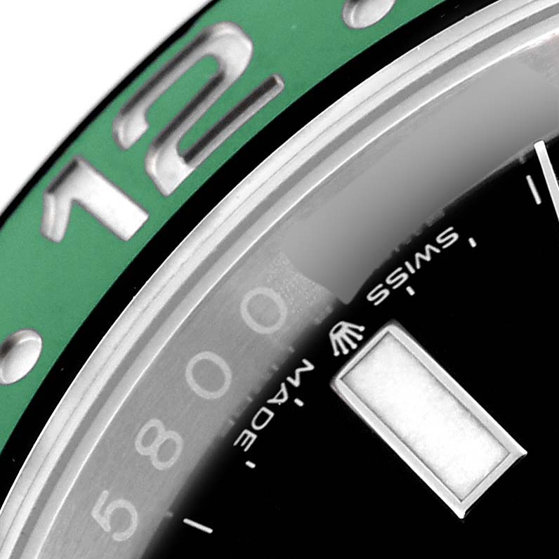 This close-up image shows the bezel, part of the dial, and the "Swiss Made" text of a Rolex GMT-Master 126720VTNR Men's Stainless Steel Black Dial 126720VTNR Men's Stainless Steel Black Dial watch.