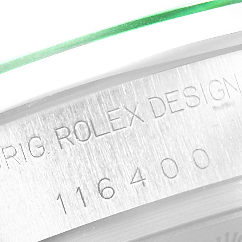 The image shows a close-up of the engraved serial number and "ROLEX DESIGN" inscription on the side of a Rolex Milgauss 116400GV Men's Stainless Steel Black Dial 116400GV Men's Stainless Steel Black Dial watch.