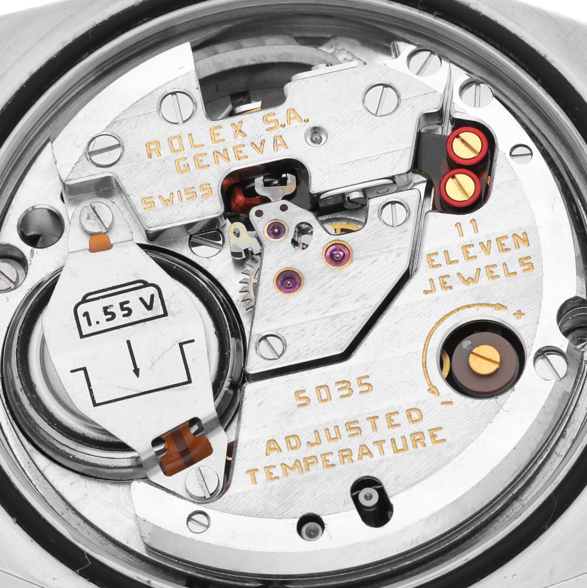 This close-up image shows the internal mechanism of a Rolex Oysterquartz 17013 Men
s Steel and Gold (two tone) White Dial 17013 Men
s Steel and Gold (two tone) White Dial model watch, including its jewels and battery compartment.