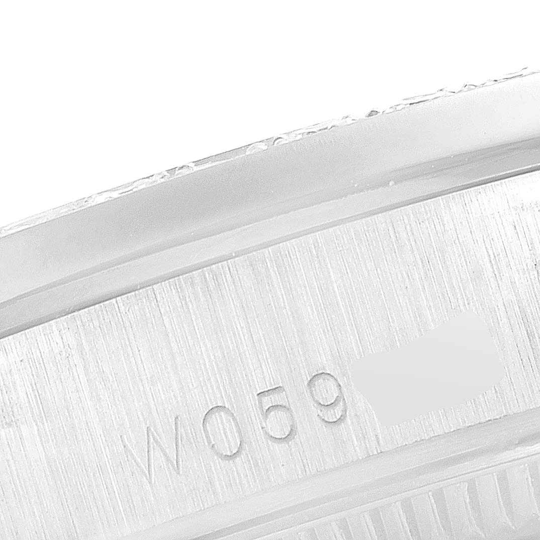 This is a close-up shot of the case side of a Rolex President 78159 Women's White Gold Silver Dial 78159 Women's White Gold Silver Dial model, showing part of the serial number and brushed metal finish.