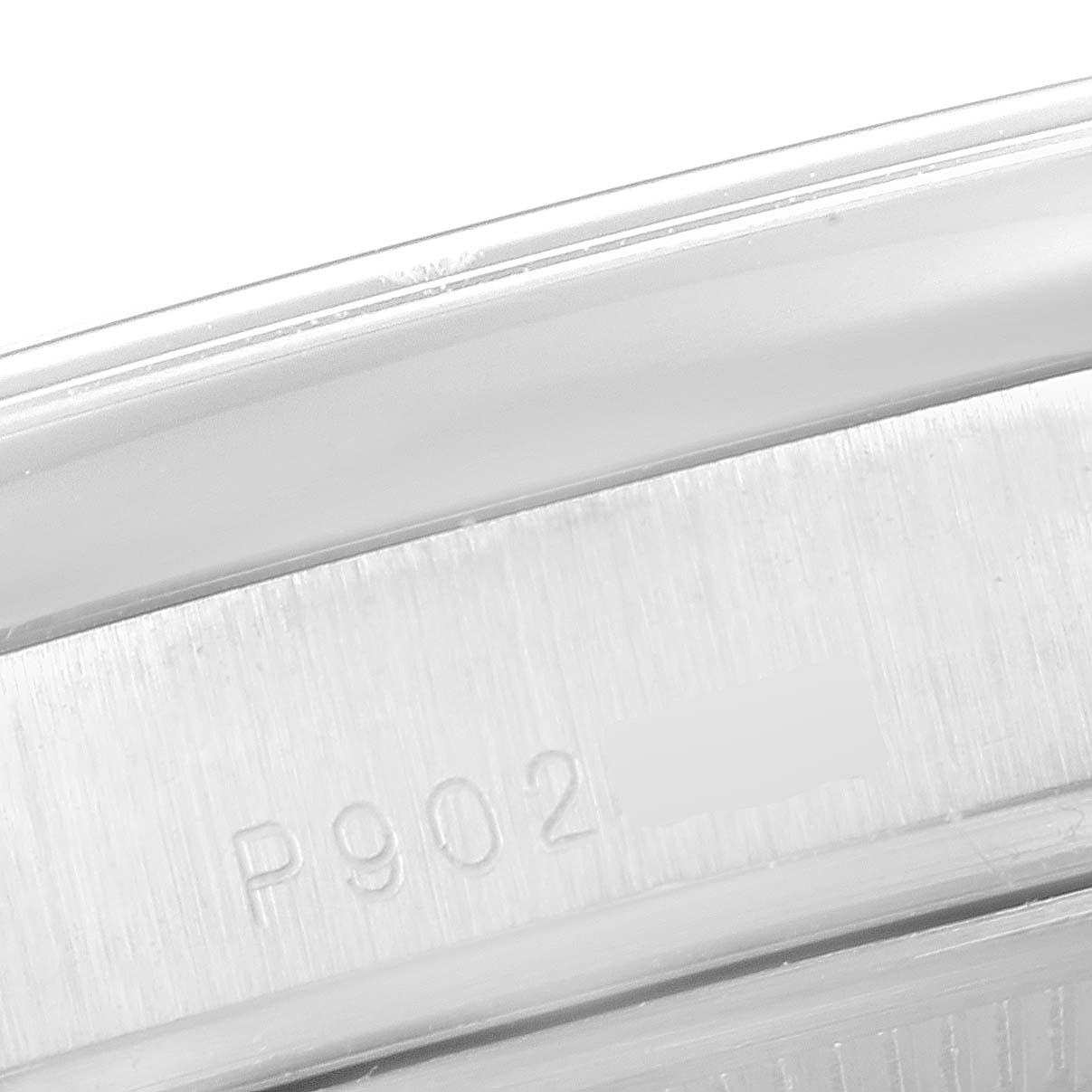 This is a close-up of the Rolex President 118206 Men's White Gold Blue Dial 118206 Men's White Gold Blue Dial watch, highlighting the engraved serial number on the case back.