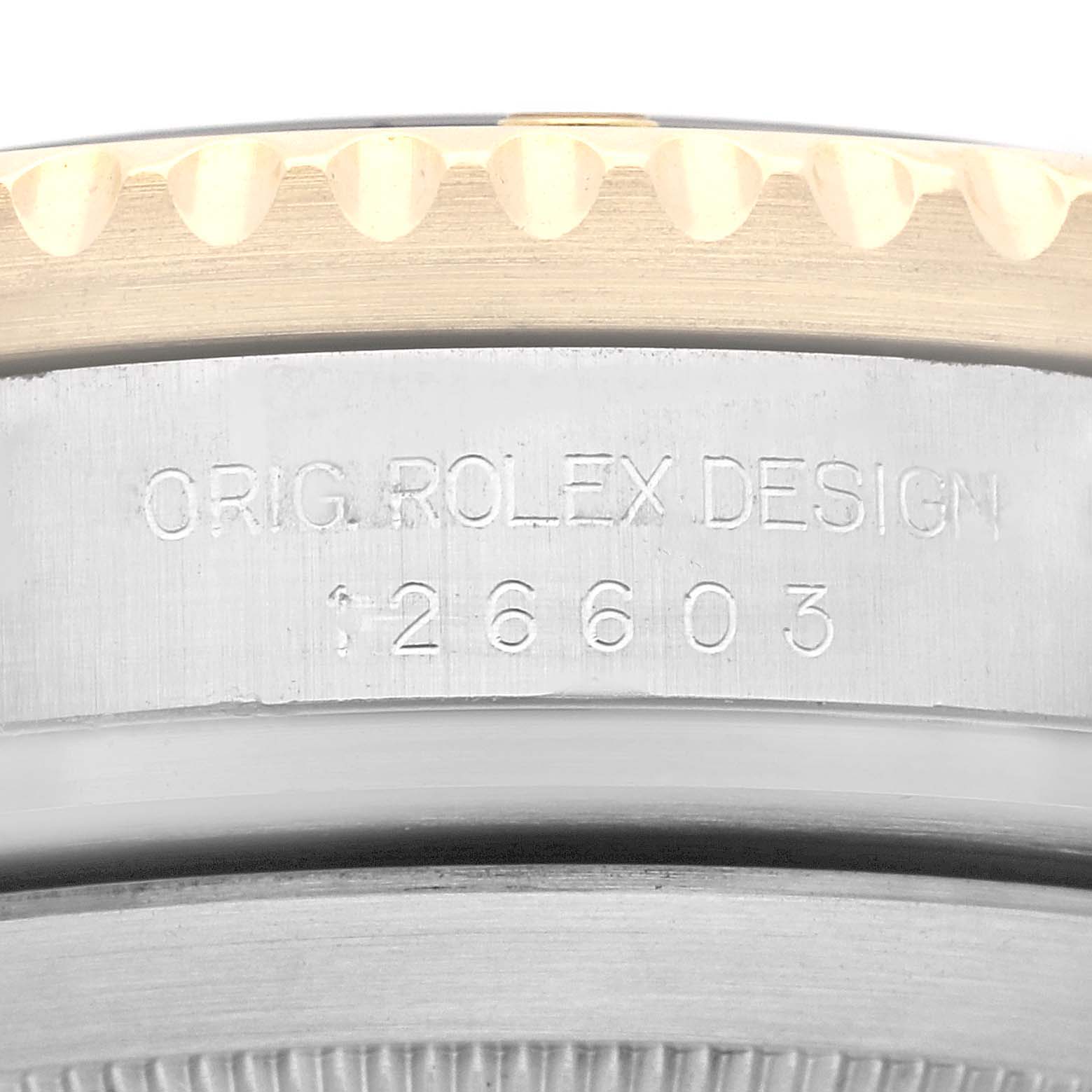 This close-up image shows the side case engraving and bezel of a Rolex Sea-Dweller 126603 Men
s Steel and Gold (two tone) Black Dial 126603 Men
s Steel and Gold (two tone) Black Dial watch.