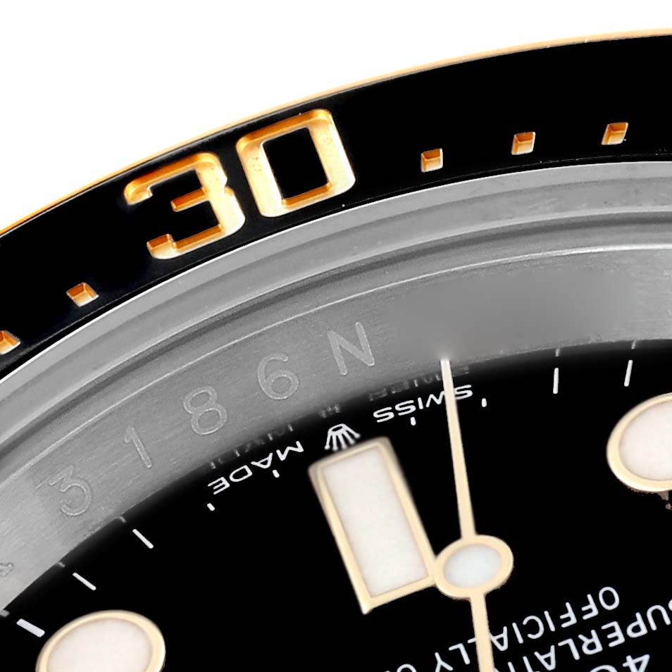 The image shows a close-up of the dial, bezel, markers, and part of the hands of a Rolex Sea-Dweller 126603 Men
s Steel and Gold (two tone) Black Dial 126603 Men
s Steel and Gold (two tone) Black Dial watch.