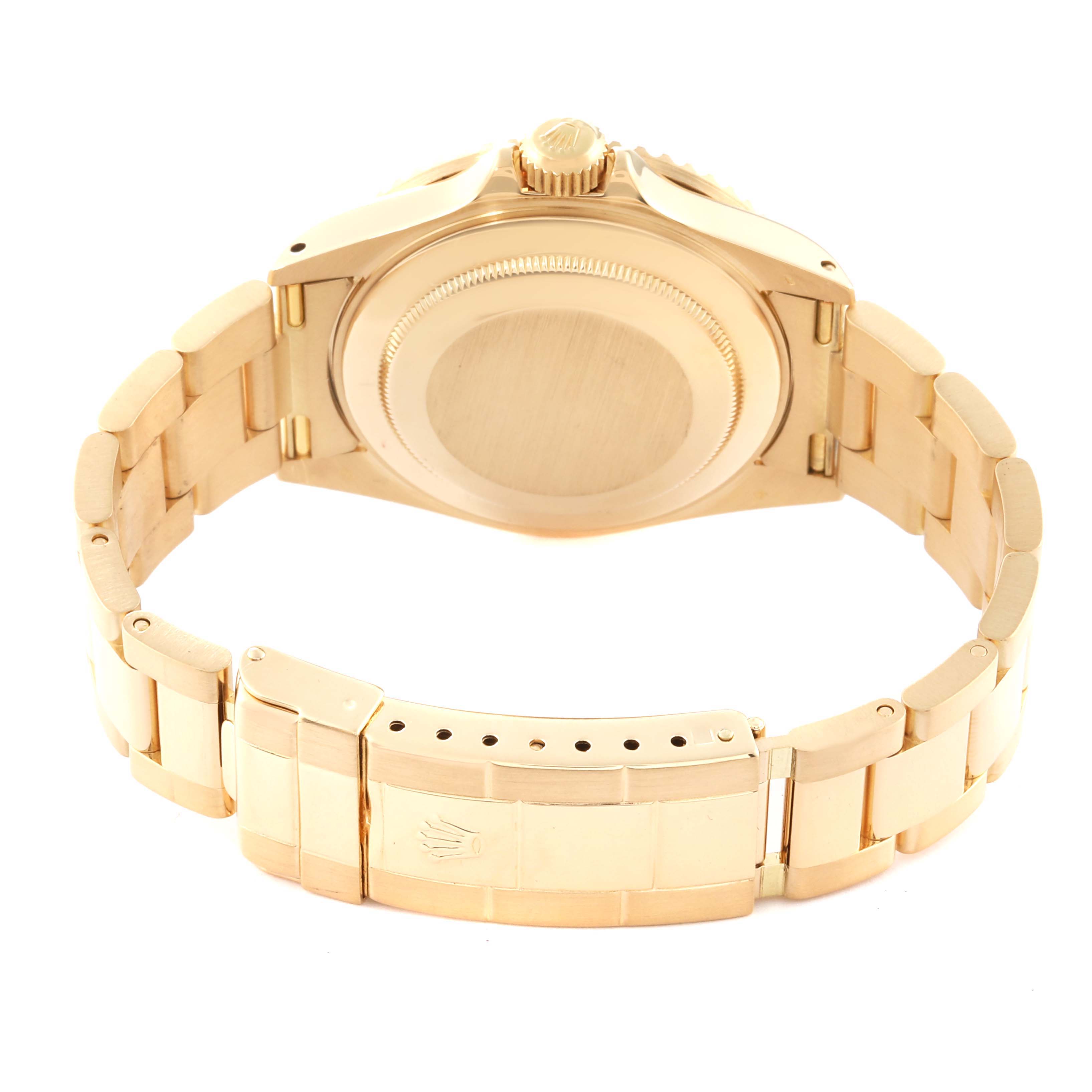 The image shows the back view of a Rolex Submariner 16618 Men's Yellow Gold Black Dial 16618 Men's Yellow Gold Black Dial watch, highlighting its case back and bracelet clasp.