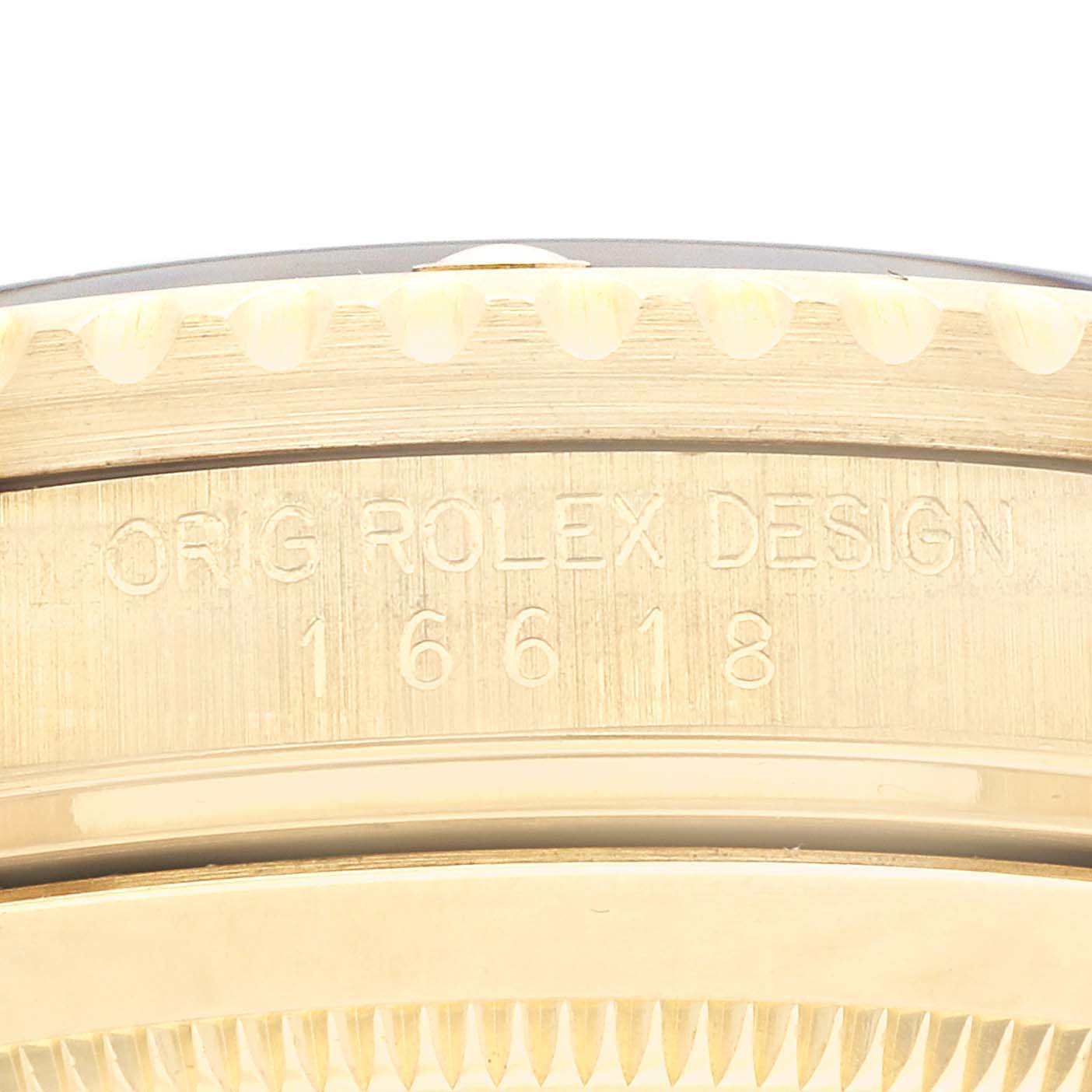 The image shows an angled close-up of the side engraving on a Rolex Submariner 16618 Men's Yellow Gold Black Dial 16618 Men's Yellow Gold Black Dial model.