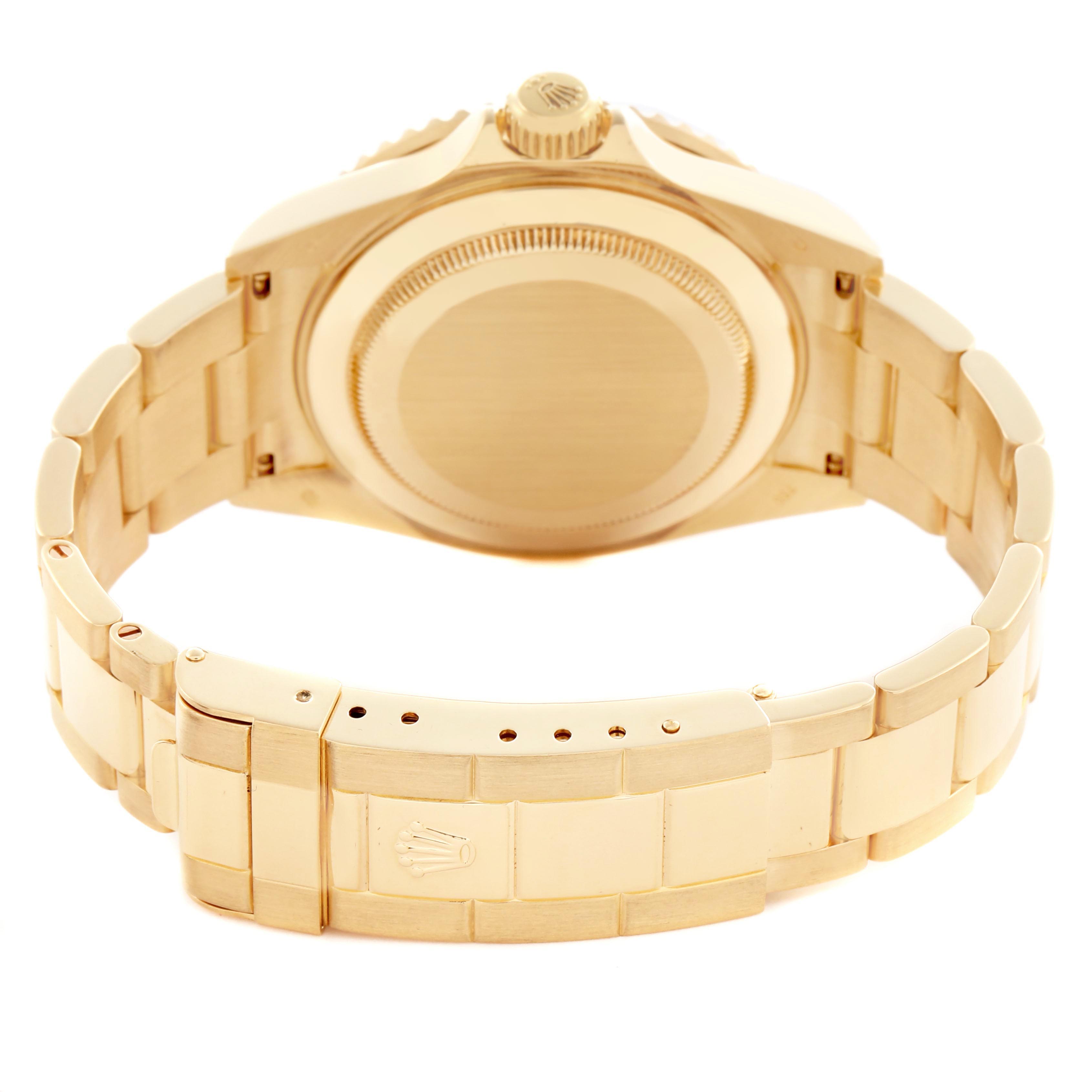 The image shows the backside and bracelet of a Rolex Submariner 16618 Men's Yellow Gold Black Dial 16618 Men's Yellow Gold Black Dial, highlighting the clasp and case back.