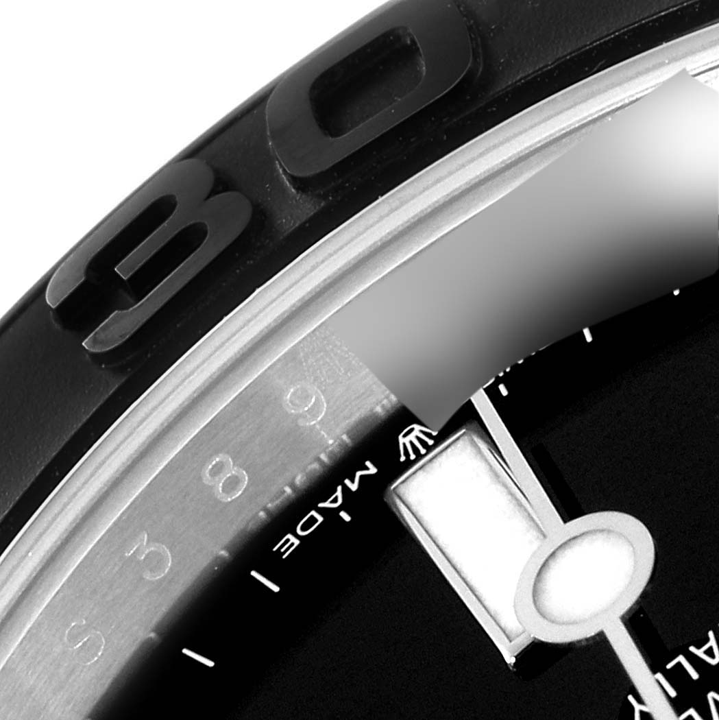 The image shows a close-up of the Rolex Yacht-Master 226659 Men's Stainless Steel Black Dial 226659 Men's Stainless Steel Black Dial's bezel and part of the dial, highlighting the number markings.