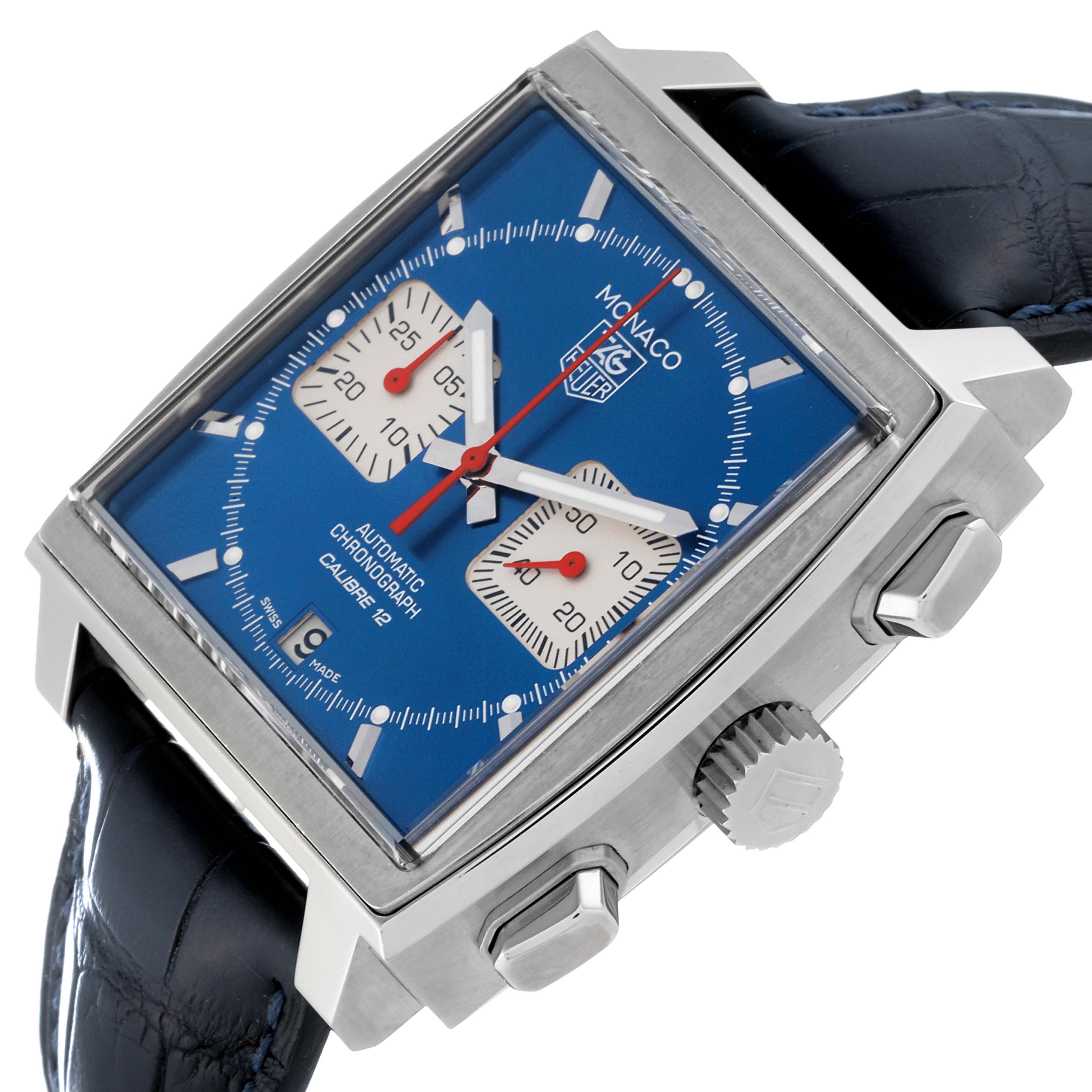 The image shows a Tag Heuer Monaco CAW2111.FC6183 Men's Stainless Steel Blue Dial CAW2111.FC6183 Men's Stainless Steel Blue Dial watch from an oblique angle, highlighting the face, crown, pushers, and leather strap.