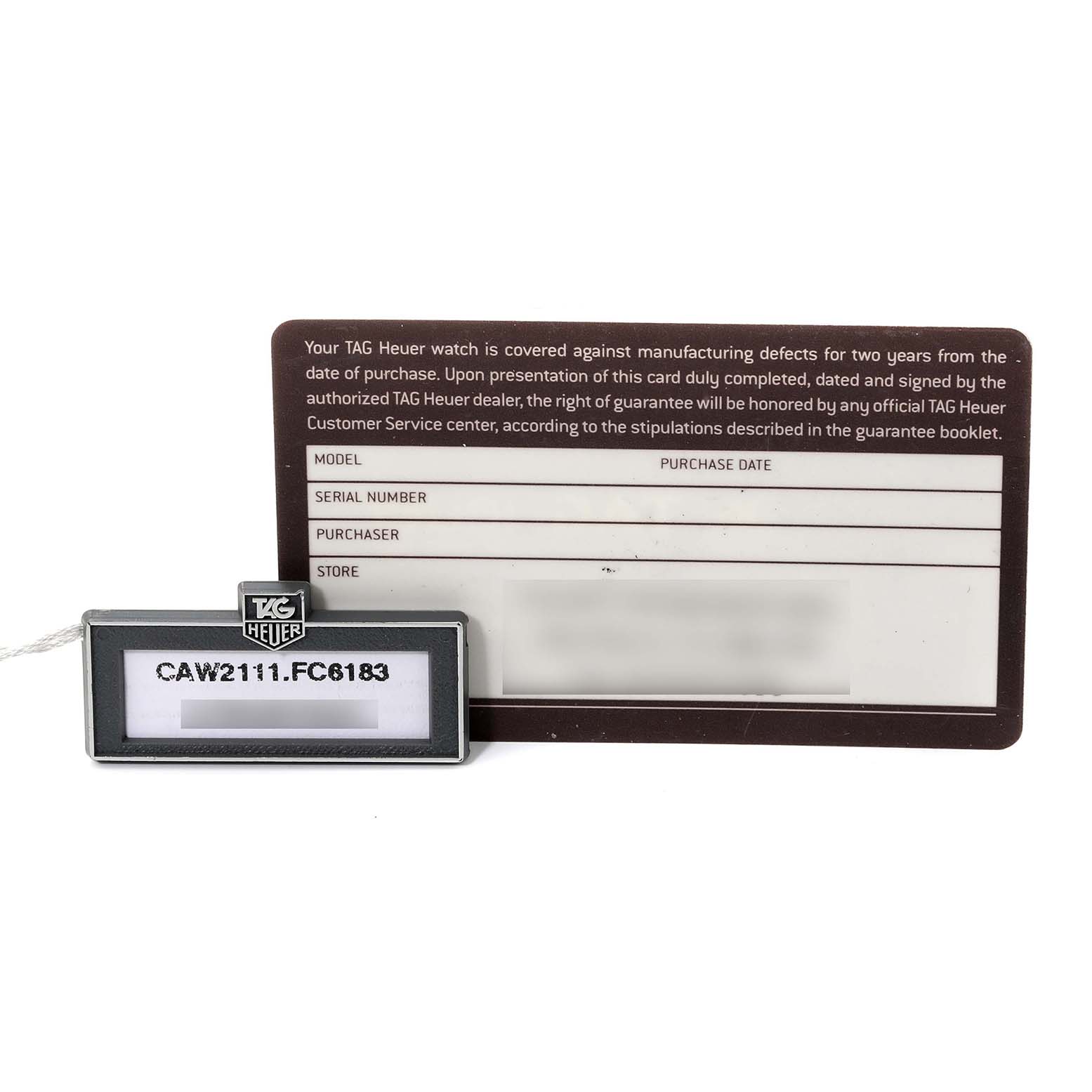 The image shows a Tag Heuer Monaco CAW2111.FC6183 Men's Stainless Steel Blue Dial CAW2111.FC6183 Men's Stainless Steel Blue Dial model watch tag and guarantee card.