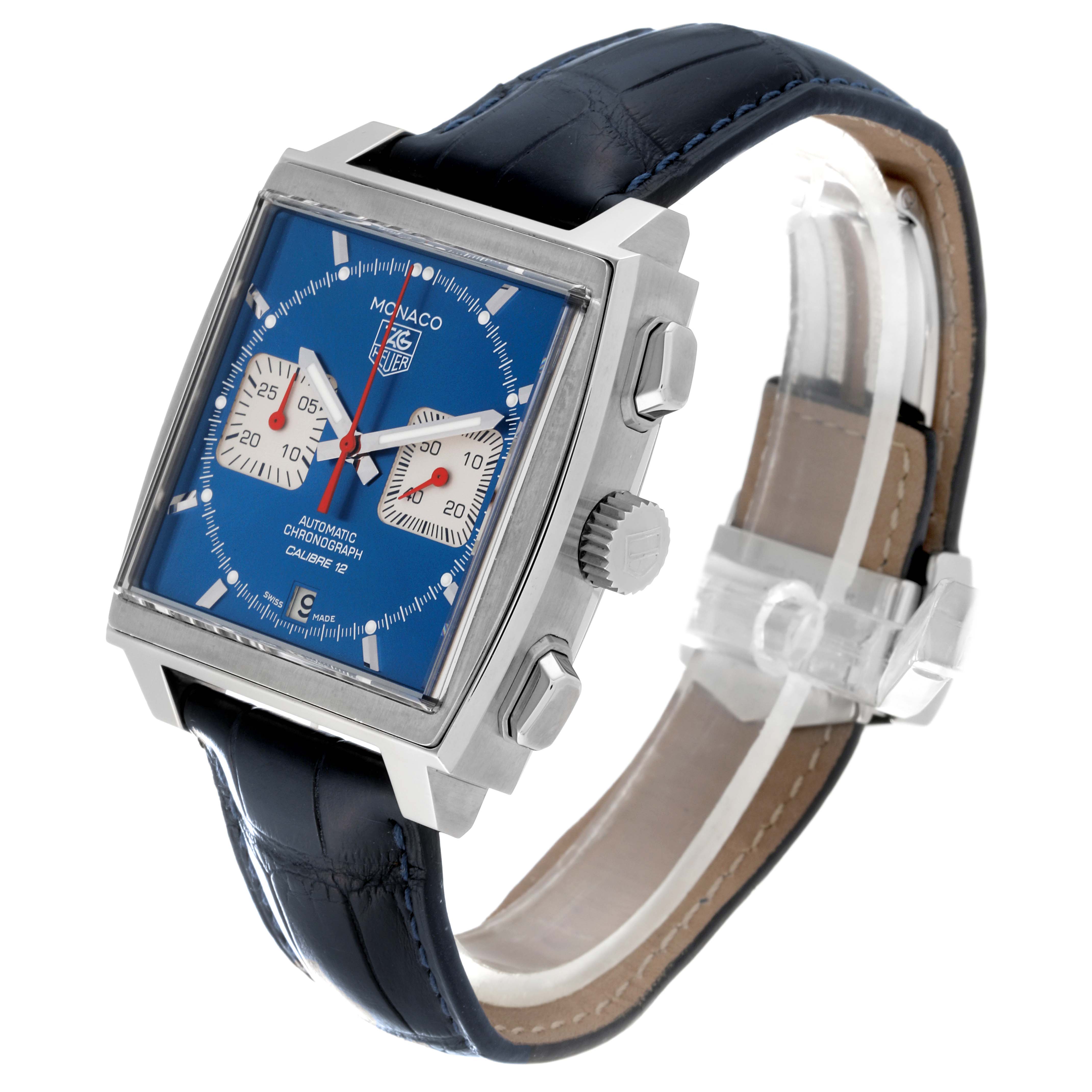 The image shows a Tag Heuer Monaco CAW2111.FC6183 Men's Stainless Steel Blue Dial CAW2111.FC6183 Men's Stainless Steel Blue Dial watch at a three-quarter angle highlighting its blue dial, square case, and black leather strap.