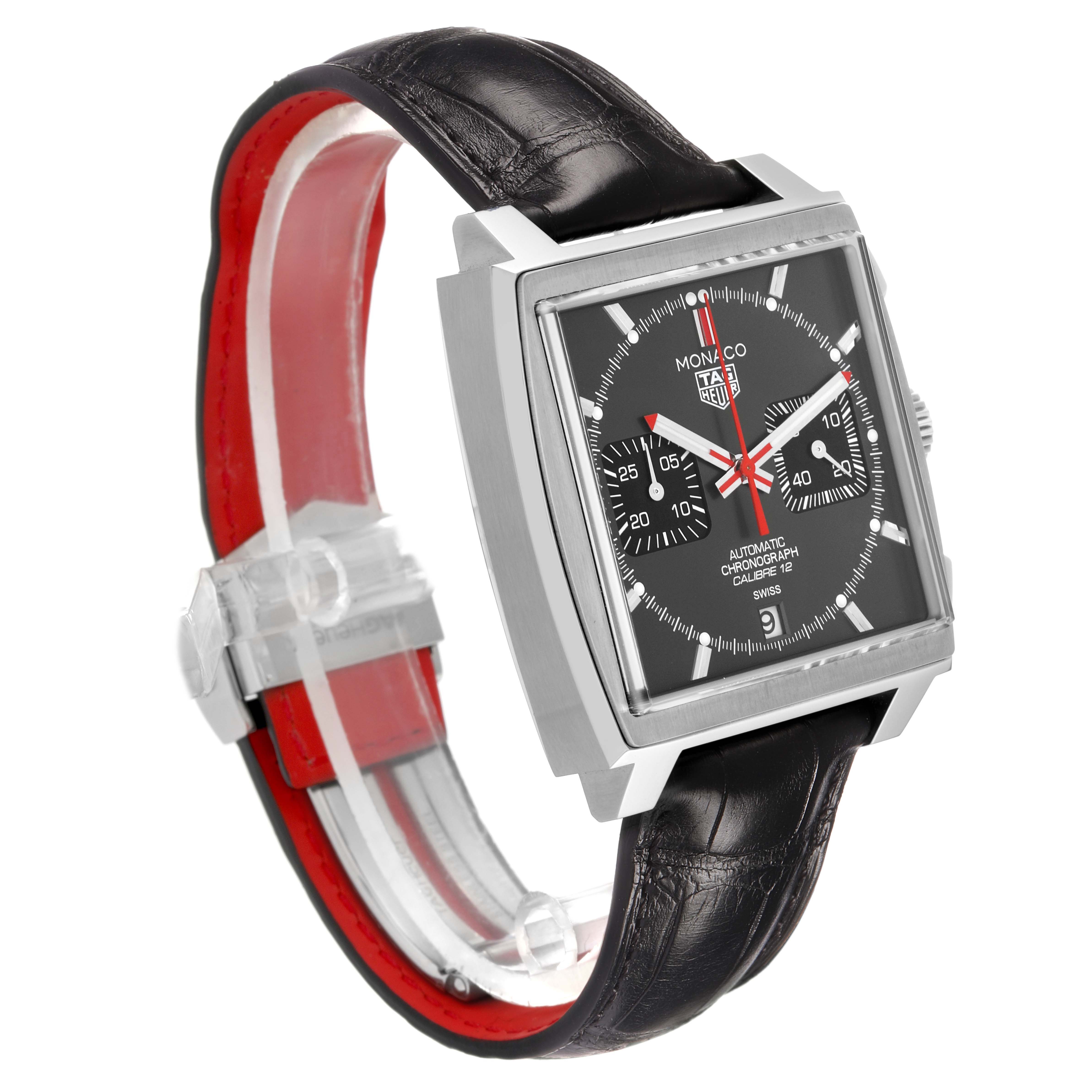 The Tag Heuer Monaco CAW211J.FC6476 Men's Stainless Steel Grey Dial watch is shown at a three-quarter angle, highlighting the square face, black strap, and red detailing.