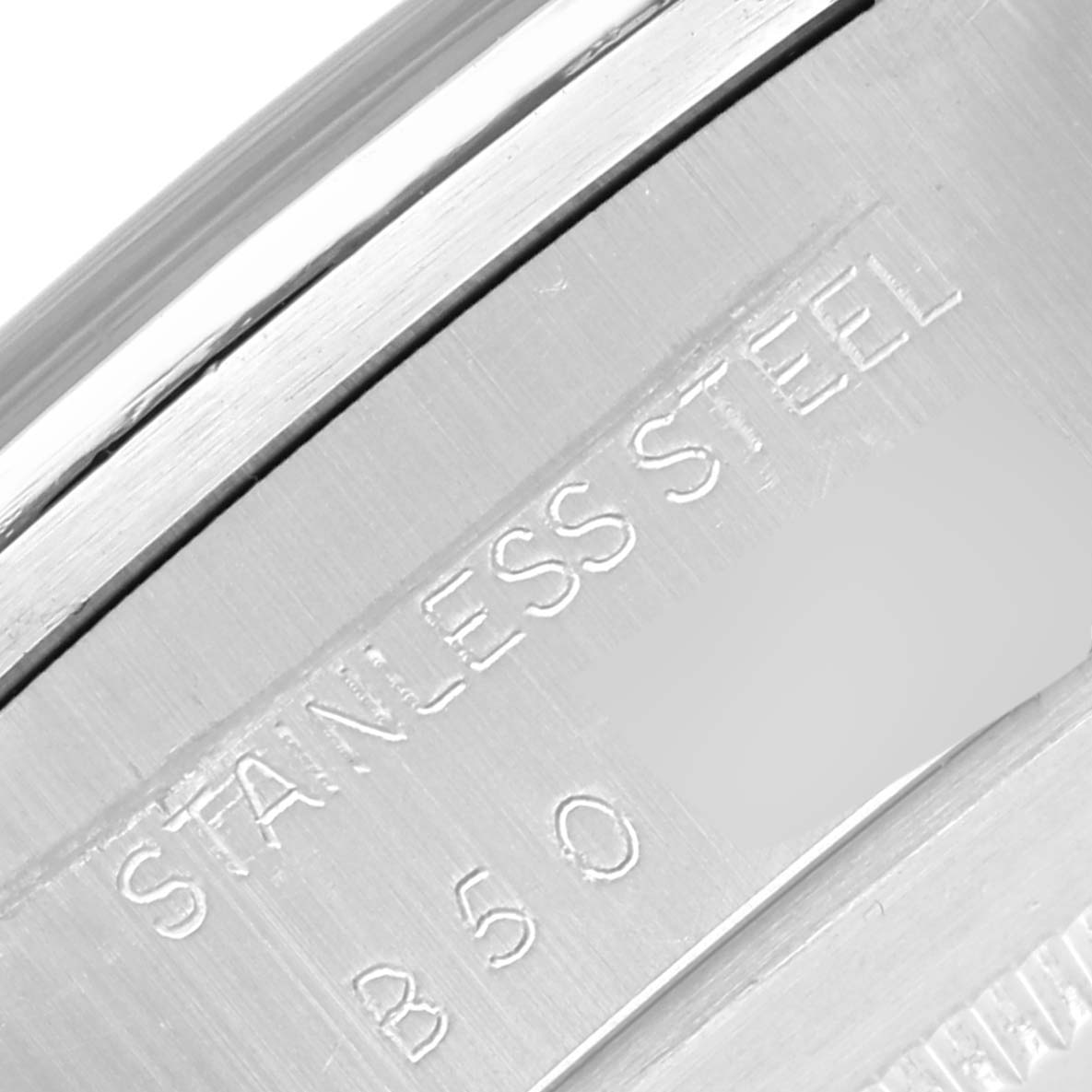This image shows a close-up of the case back of a Tudor Big Block 79180 Men's Stainless Steel Silver Dial 79180 Men's Stainless Steel Silver Dial model, highlighting the "STAINLESS STEEL" engraving.