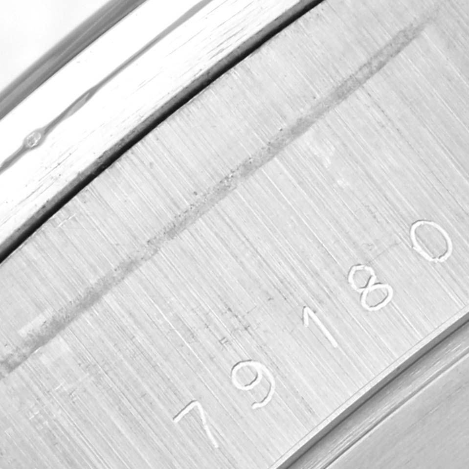 This close-up image shows the serial number engraving on the case of a Tudor Big Block 79180 Men's Stainless Steel Silver Dial 79180 Men's Stainless Steel Silver Dial model watch.