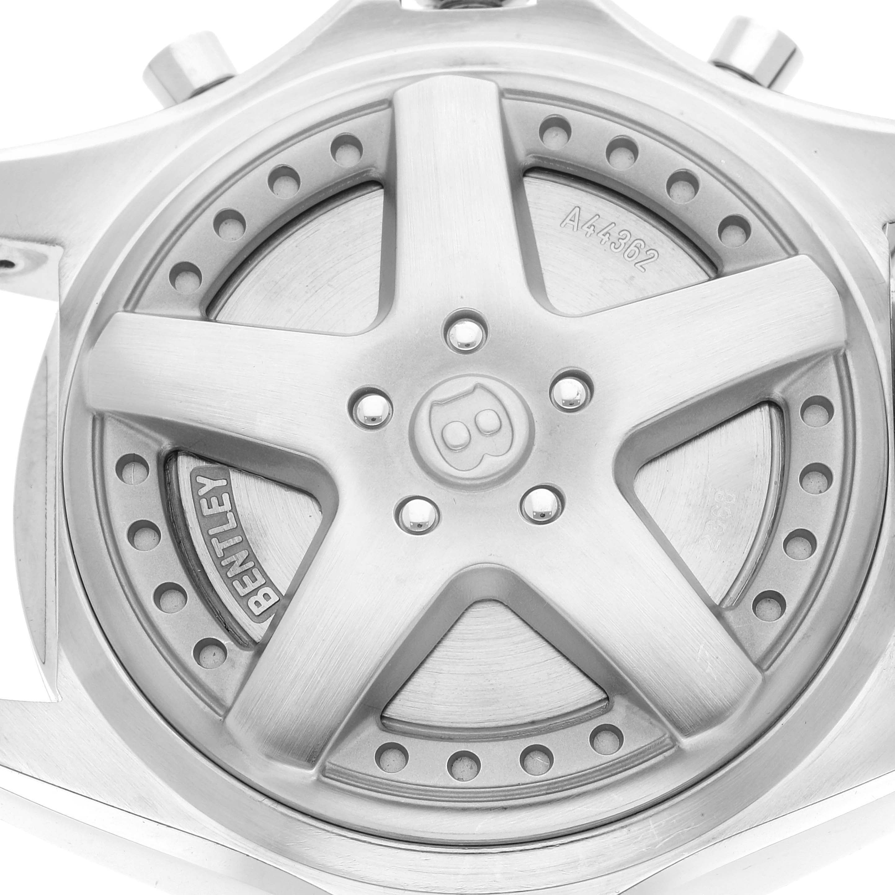 The image shows the case back of the Bentley model by Breitling, featuring a design element with the Bentley logo.