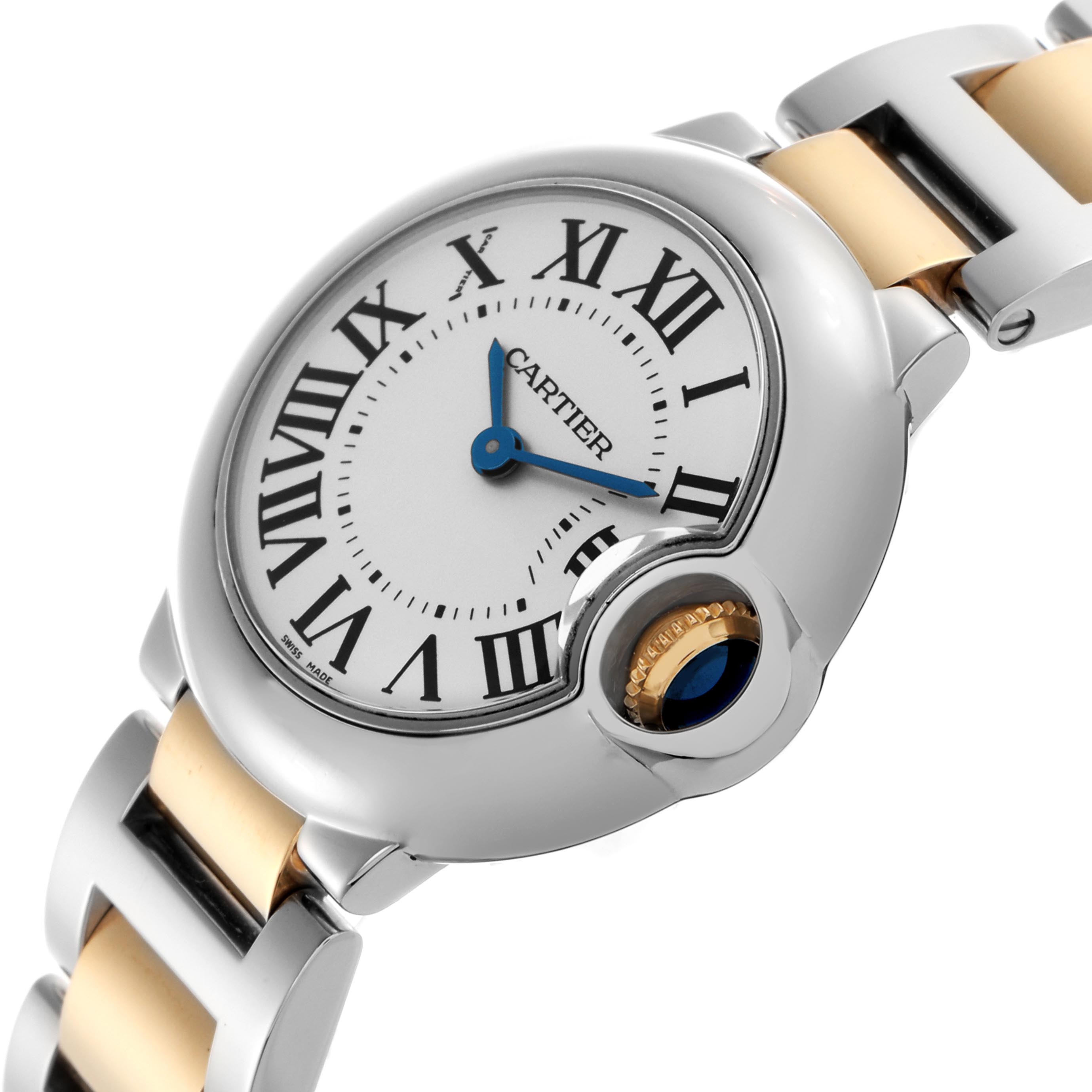 The Cartier Ballon Bleu W69007Z3 Women
s Steel and Gold (two tone) Silver Dial W69007Z3 Women
s Steel and Gold (two tone) Silver Dial watch is shown at an angle highlighting the dial, blue hands, Roman numerals, crown, and two-tone bracelet.