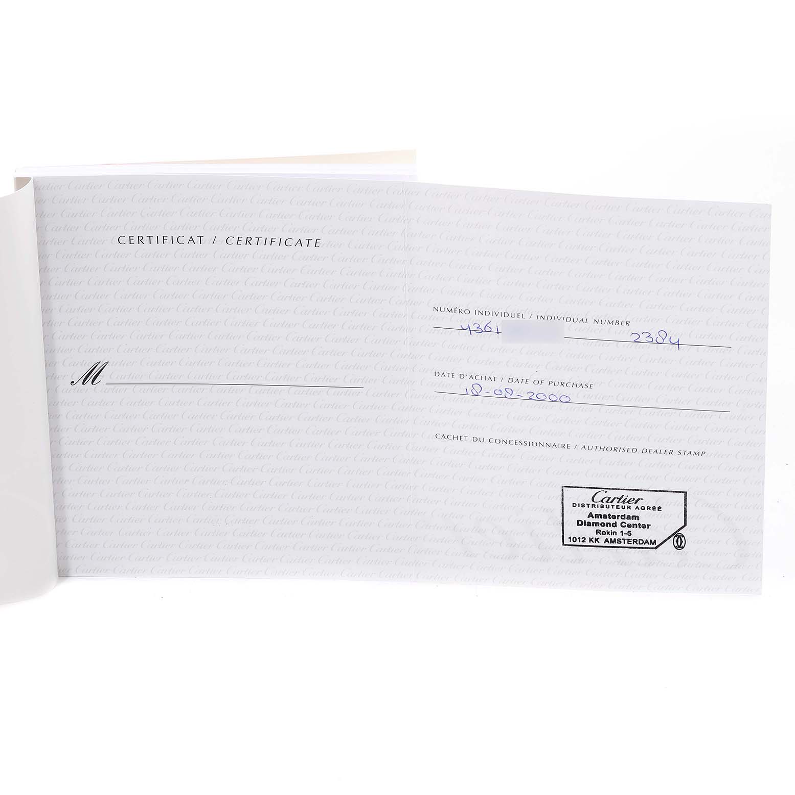 The image shows an open warranty certificate for the Cartier Tank Francaise W51007Q4 Women's Steel and Gold (two tone) Silver Dial W51007Q4 Women's Steel and Gold (two tone) Silver Dial watch model, featuring the purchase date and dealer stamp.