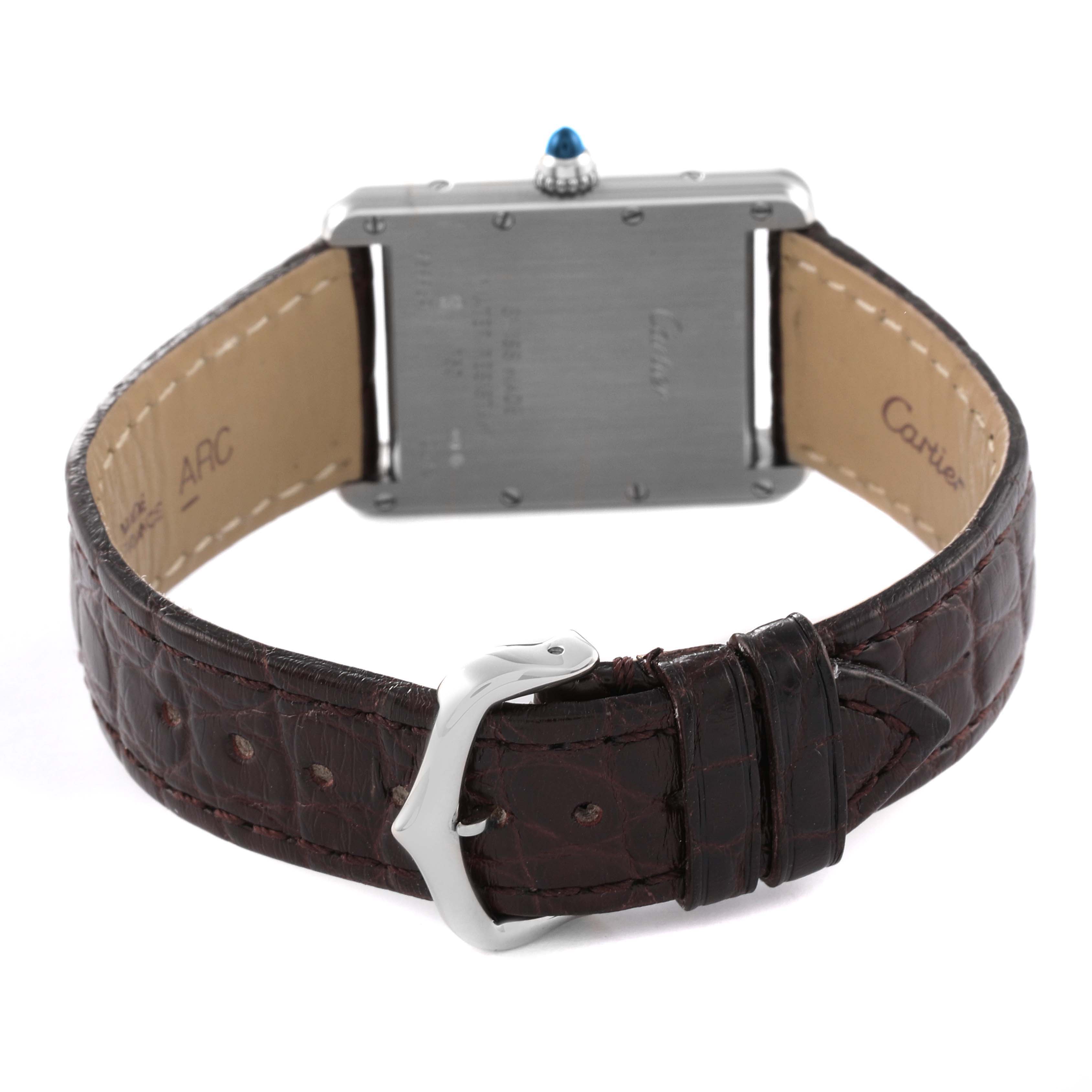 This image shows the back view of a Tank Louis Cartier watch, highlighting its case, leather strap, and buckle.