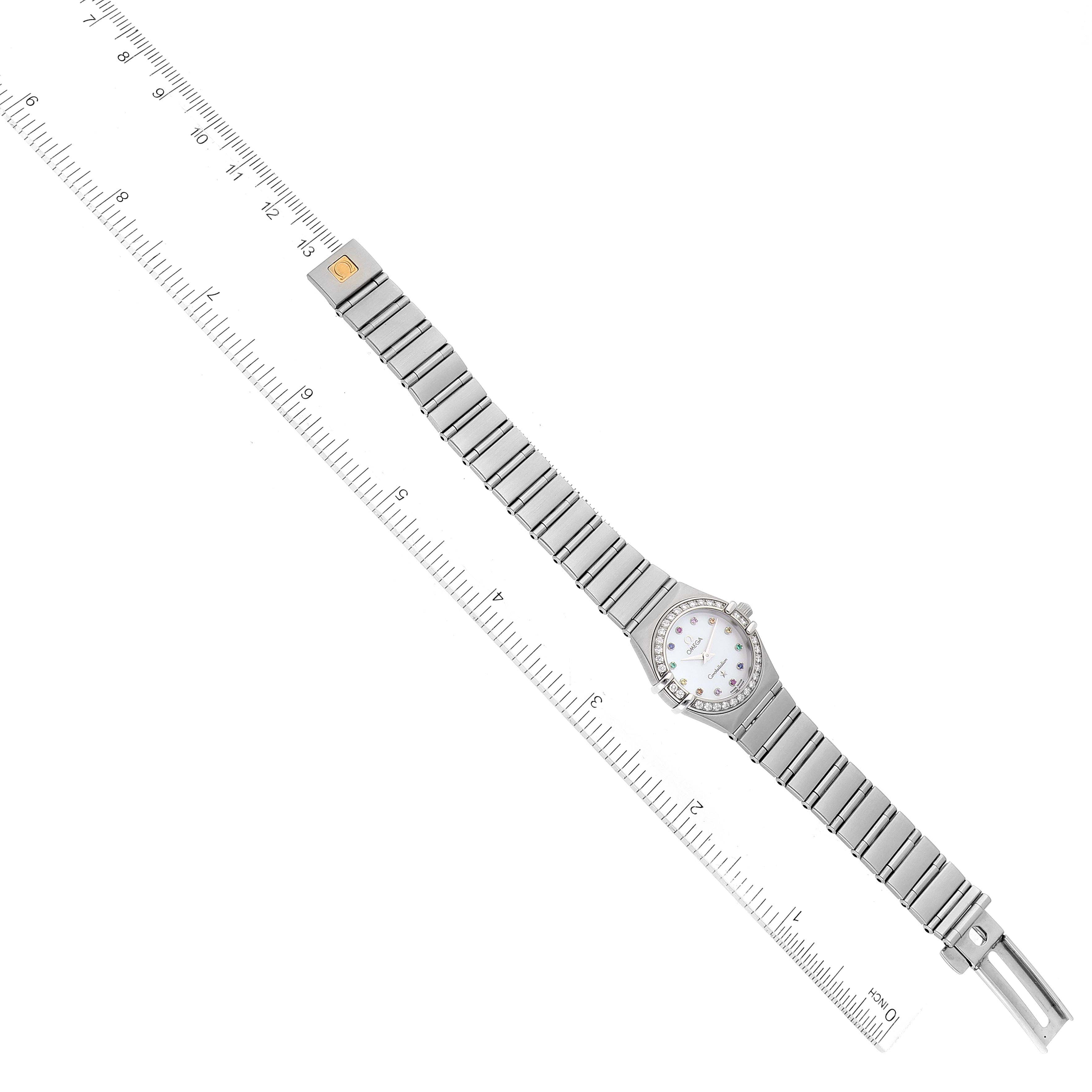 This image shows the Omega 1460.79.00 Women's Stainless Steel Mother of Pearl Dial 1460.79.00 Women's Stainless Steel Mother of Pearl Dial Constellation Iris Steel Multi Stone Ladies Watch 1460.79.00 laid flat with a ruler for scale.