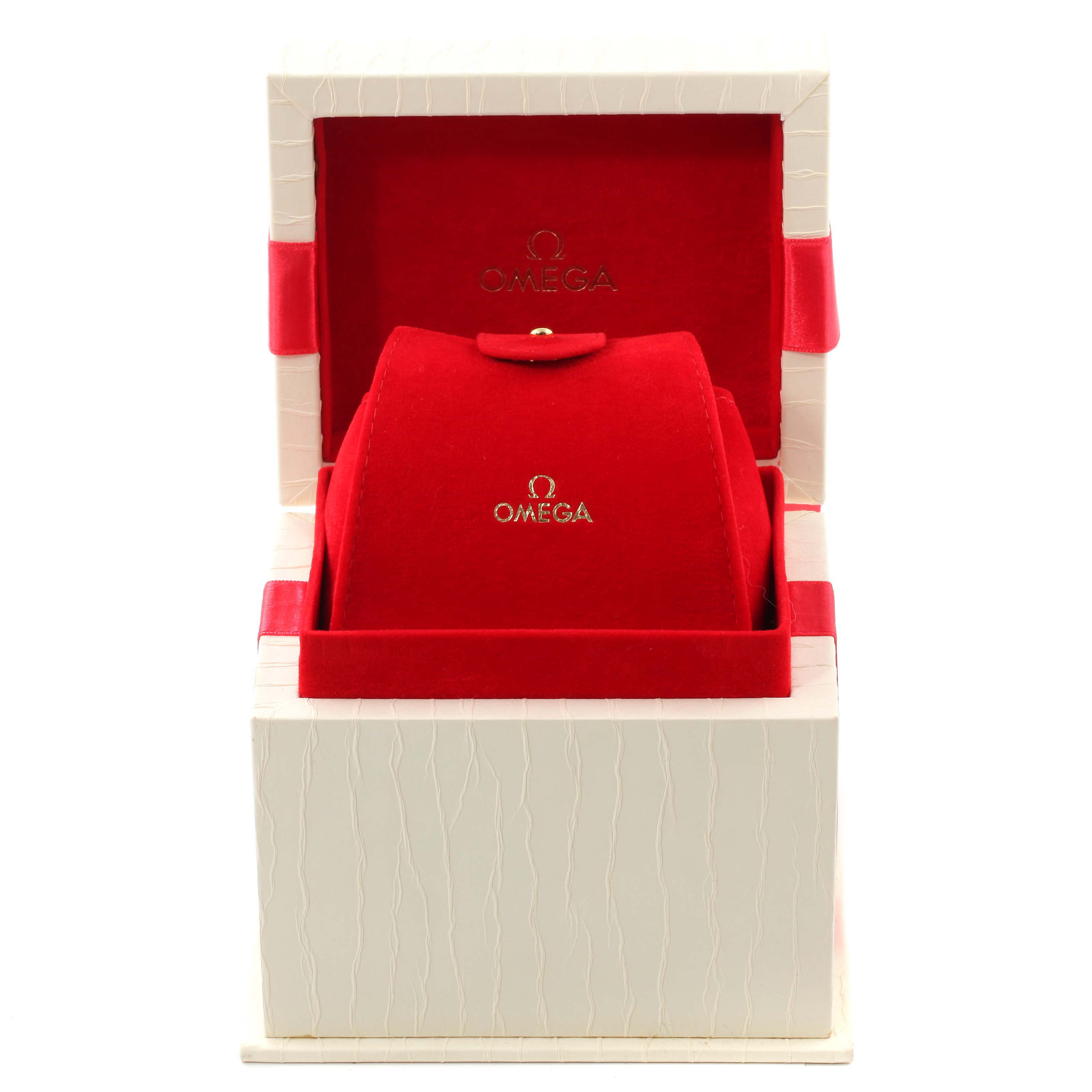 The image shows the red velvet and white textured box for the Omega 1460.79.00 Women's Stainless Steel Mother of Pearl Dial 1460.79.00 Women's Stainless Steel Mother of Pearl Dial Constellation Iris Steel Multi Stone Ladies Watch 1460.79.00.