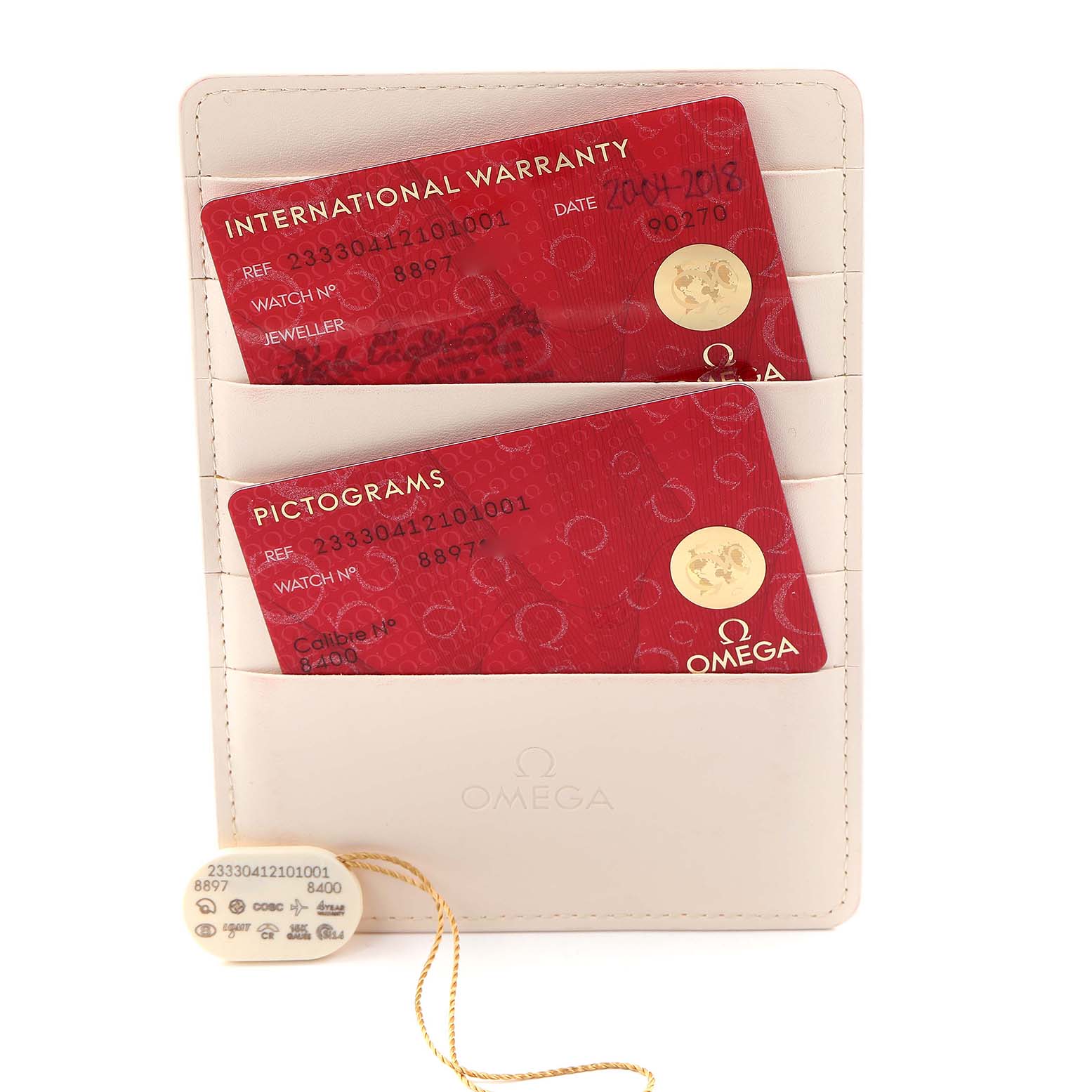 The image shows Omega Seamaster 233.30.41.21.01.001 Men
s Stainless Steel Black Dial 233.30.41.21.01.001 Men
s Stainless Steel Black Dial warranty cards and a tag, displayed in a holder.