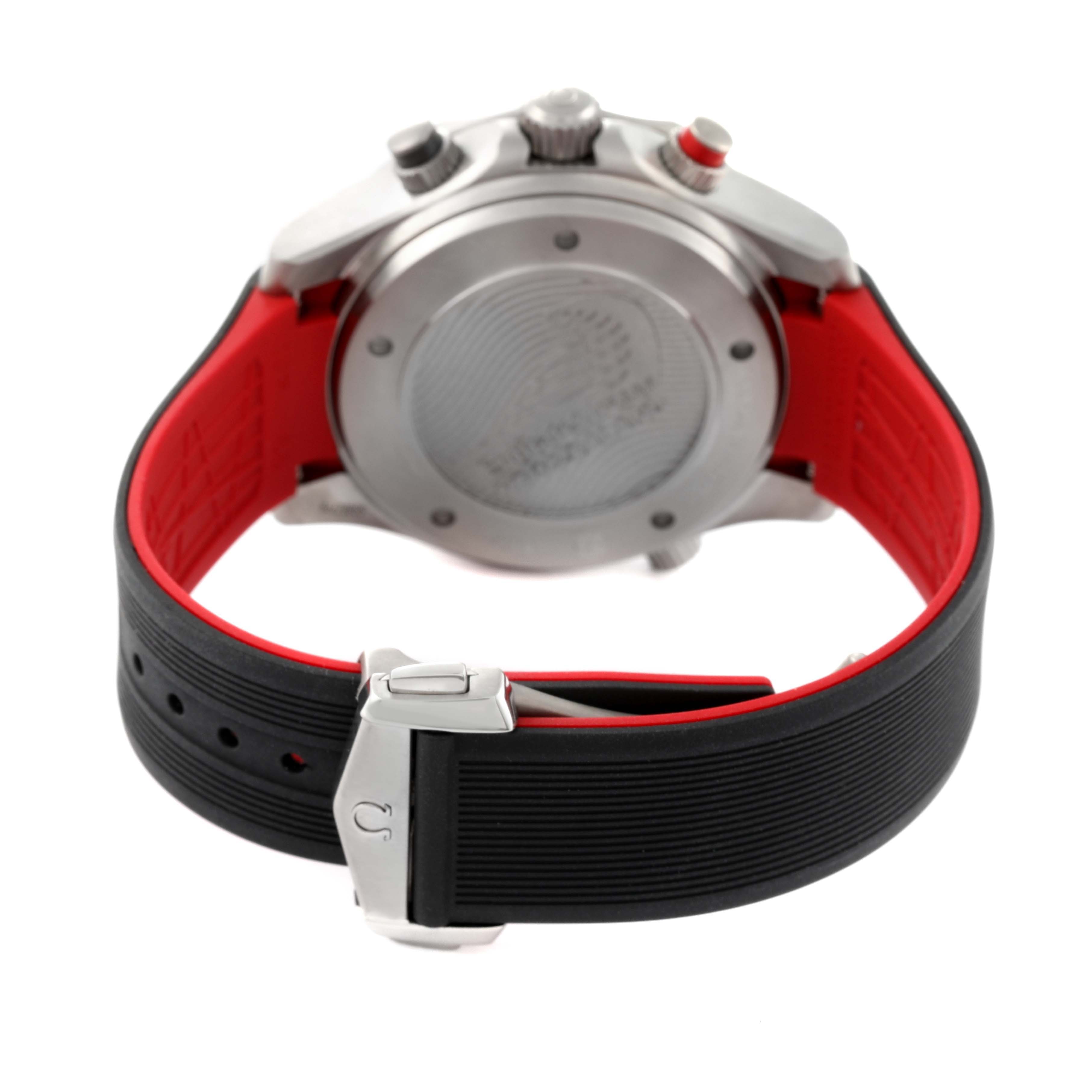 This image shows the back case, lugs, and buckle of an Omega Seamaster 212.92.44.50.99.001 Men's Titanium Grey Dial 212.92.44.50.99.001 Men's Titanium Grey Dial watch with a black and red strap.