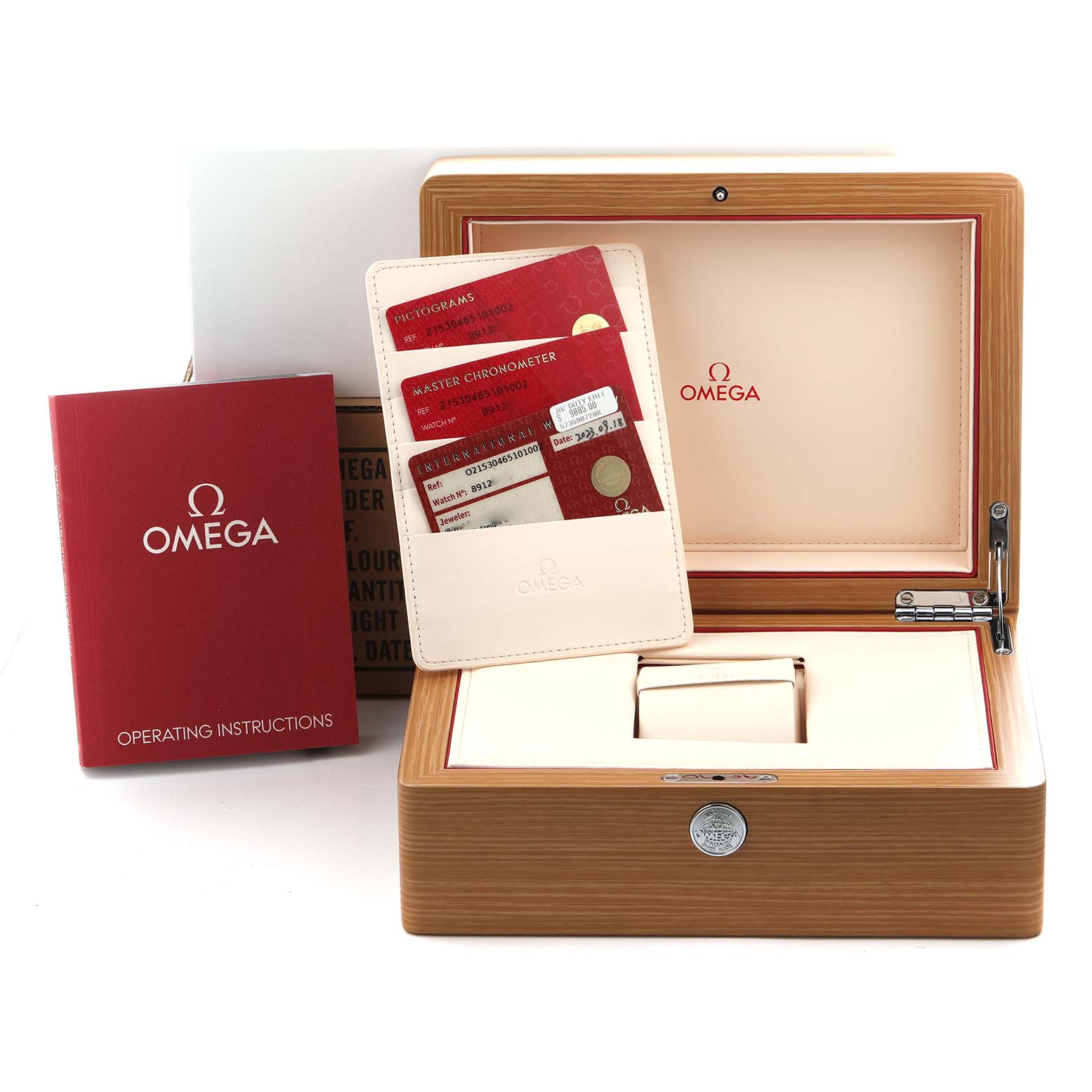 The image shows an Omega Planet Ocean 215.30.46.51.01.002 Men
s Stainless Steel Black Dial 215.30.46.51.01.002 Men
s Stainless Steel Black Dial watch box set with a wooden case, red instruction booklet, and warranty cards.