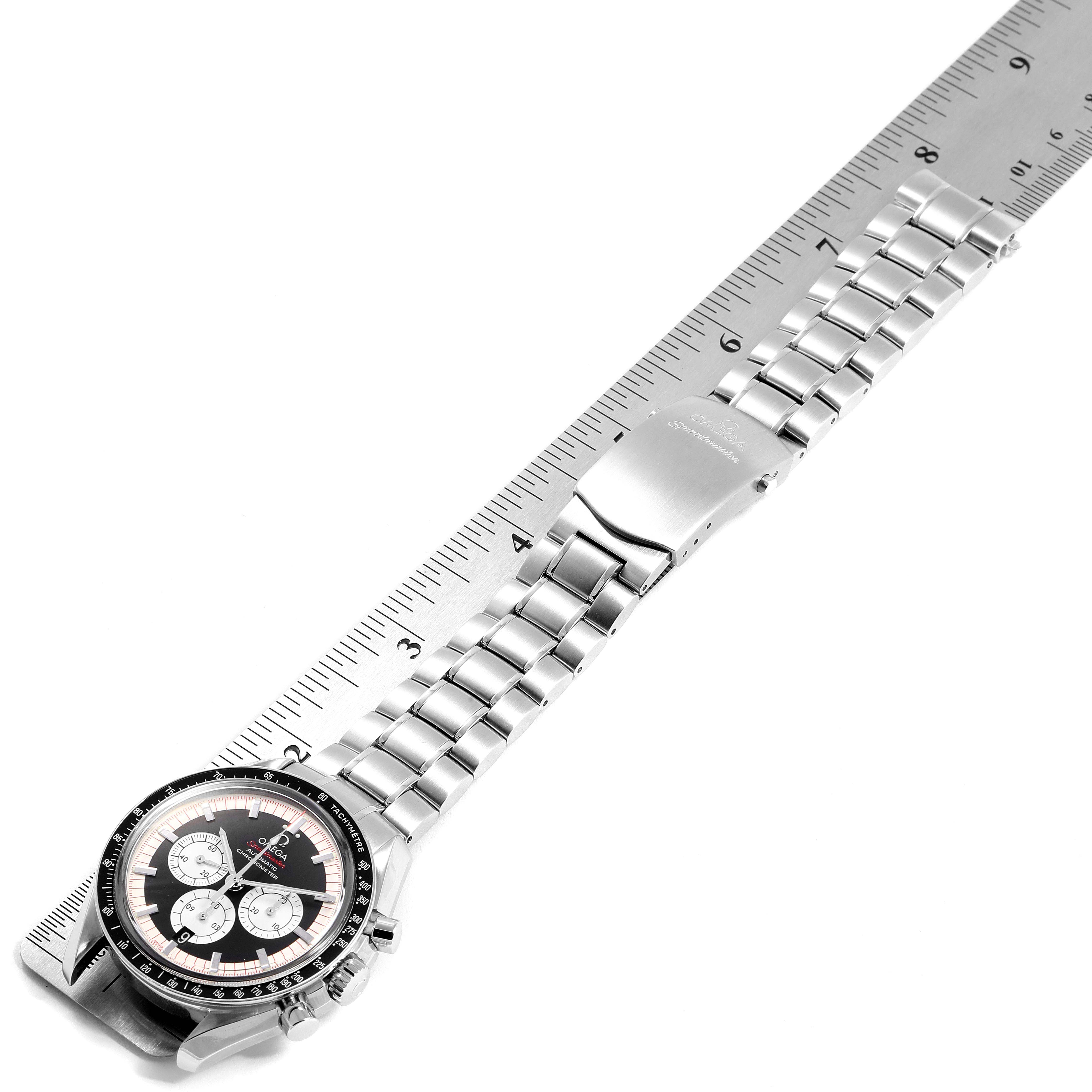 The image shows the Omega Speedmaster 3507.51.00 Men
s Stainless Steel Black Dial 3507.51.00 Men
s Stainless Steel Black Dial watch laid flat next to a ruler, displaying the watch face and metal bracelet.