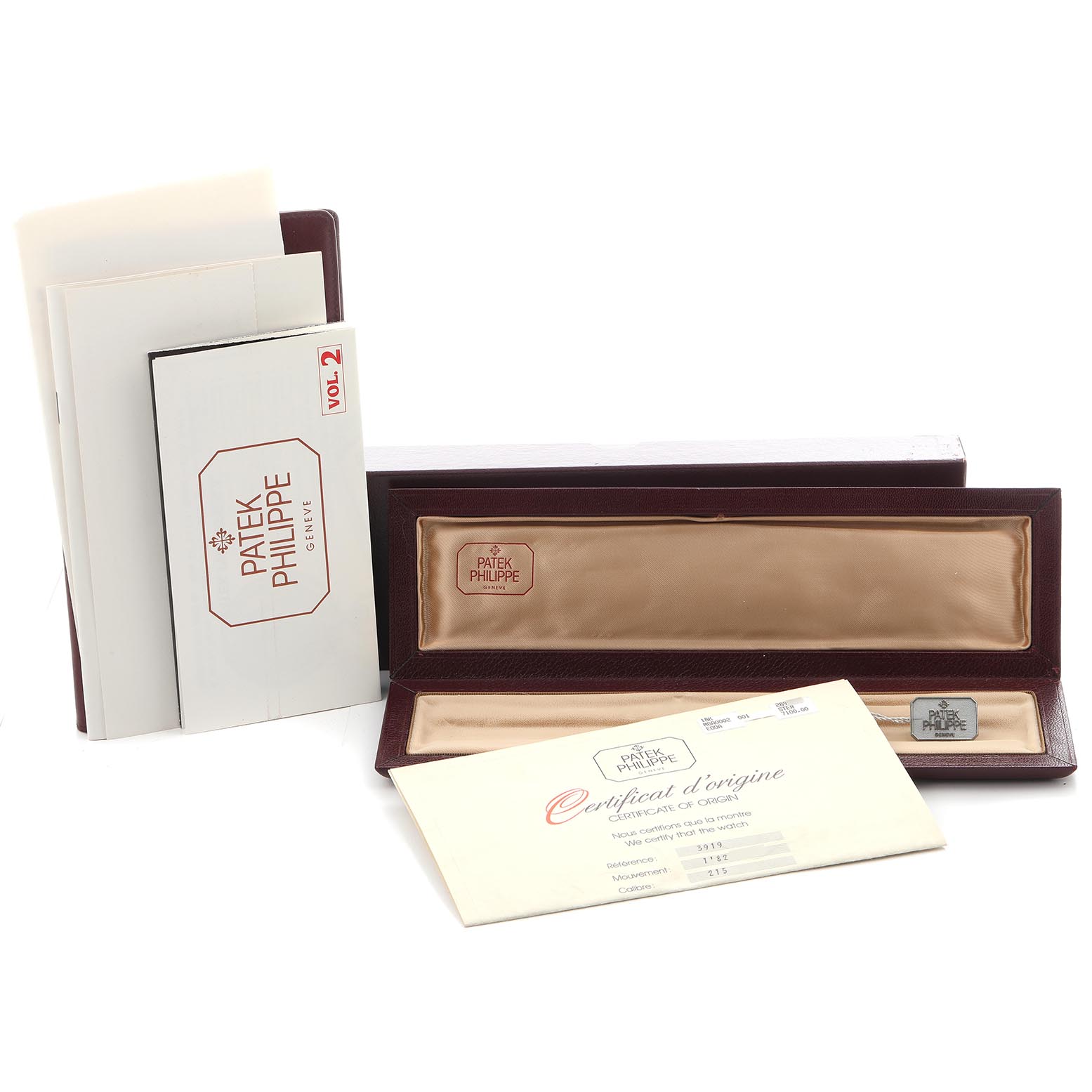 The image shows a Patek Philippe Calatrava 3919J-001 Men
s Yellow Gold White Dial 3919J-001 Men
s Yellow Gold White Dial watch box with documents, viewed from the front.