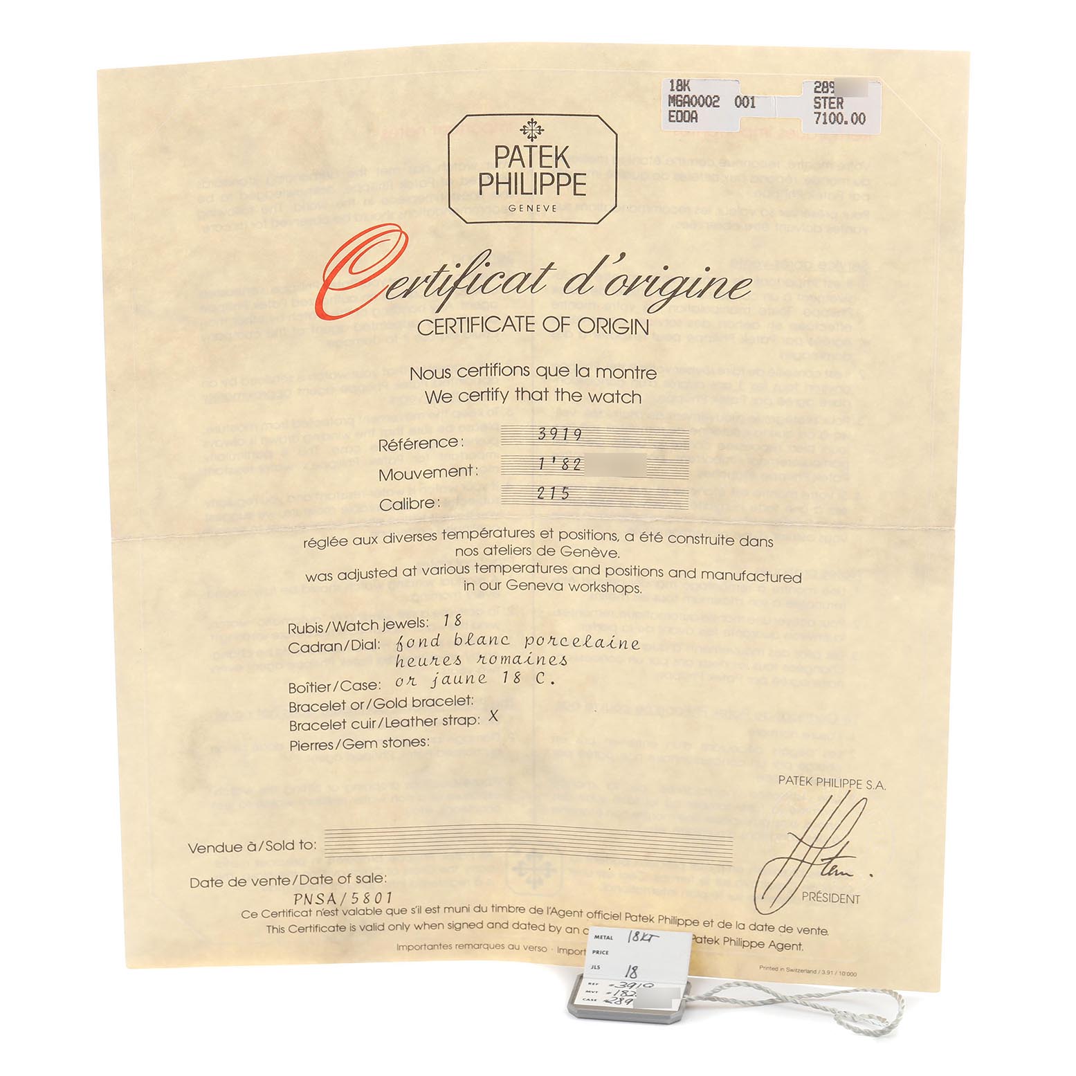 The image shows a Patek Philippe Calatrava 3919J-001 Men
s Yellow Gold White Dial 3919J-001 Men
s Yellow Gold White Dial certificate of origin and a small tag, viewed from the front.