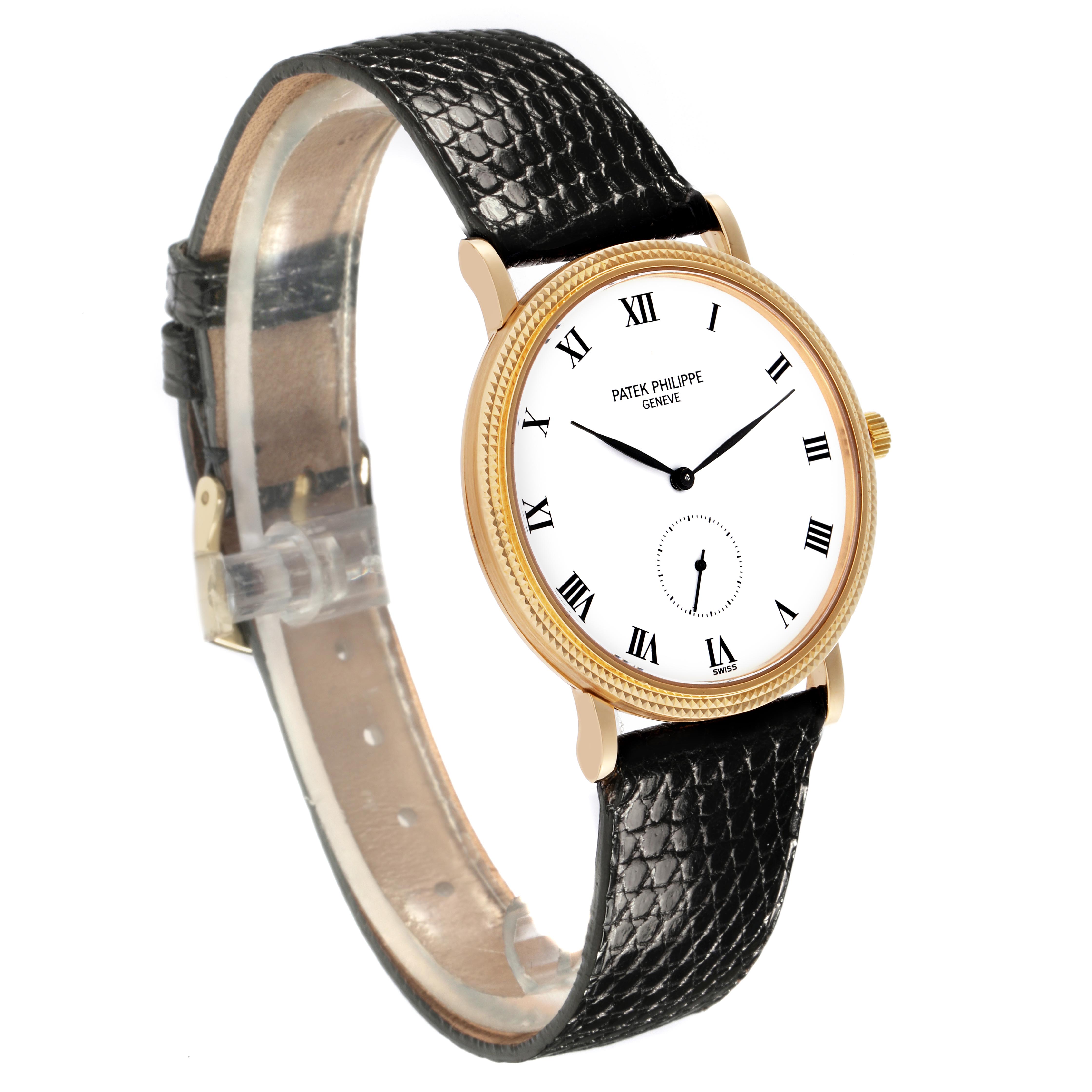 The Patek Philippe Calatrava 3919J-001 Men
s Yellow Gold White Dial 3919J-001 Men
s Yellow Gold White Dial watch is shown at a three-quarter angle, highlighting the face, bezel, case, crown, and leather strap.