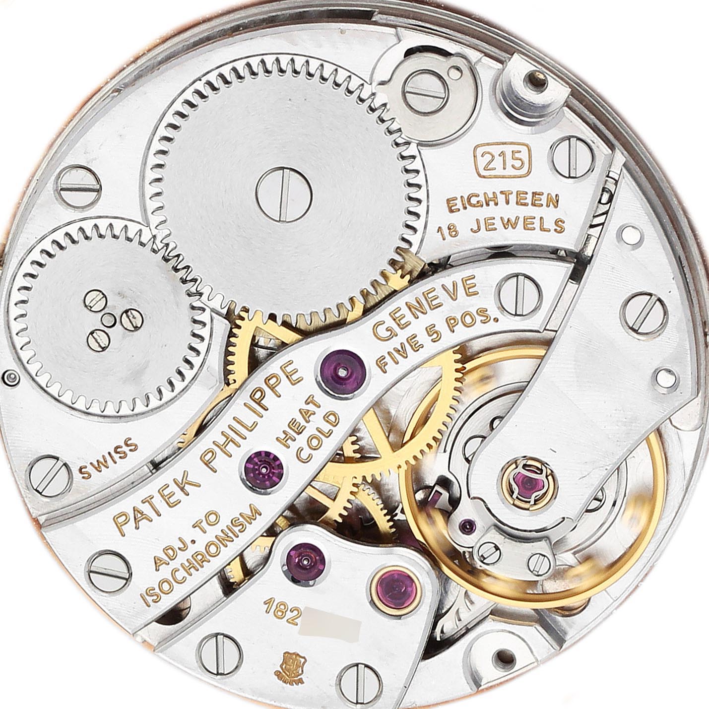 The image shows the movement of a Patek Philippe Calatrava 3919J-001 Men
s Yellow Gold White Dial 3919J-001 Men
s Yellow Gold White Dial watch, highlighting gears and jewels from a top-down angle.