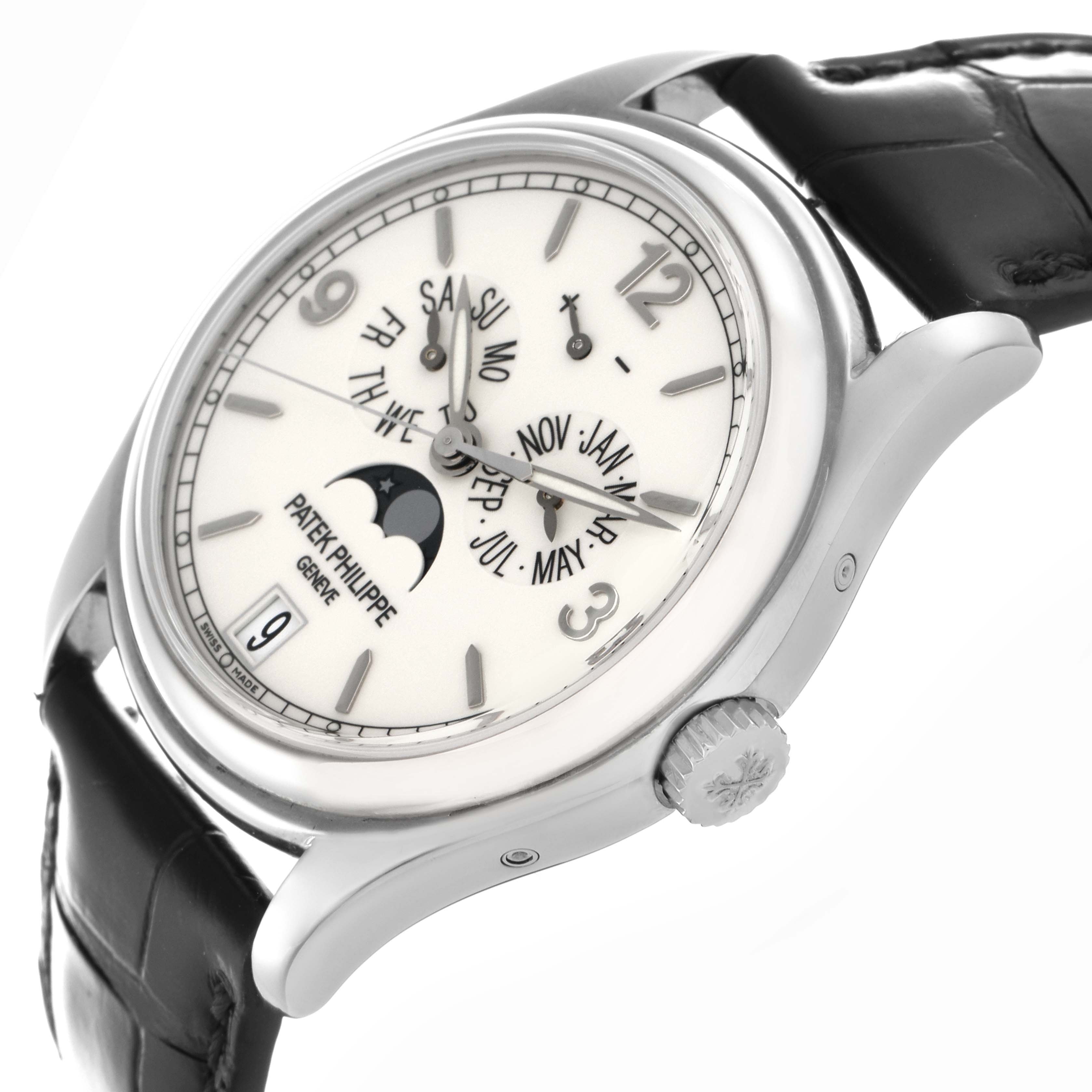 The Patek Philippe Complications 5146G Men
s White Gold White Dial 5146G Men
s White Gold White Dial watch is shown from a three-quarter angle, highlighting the face, crown, and part of the strap.