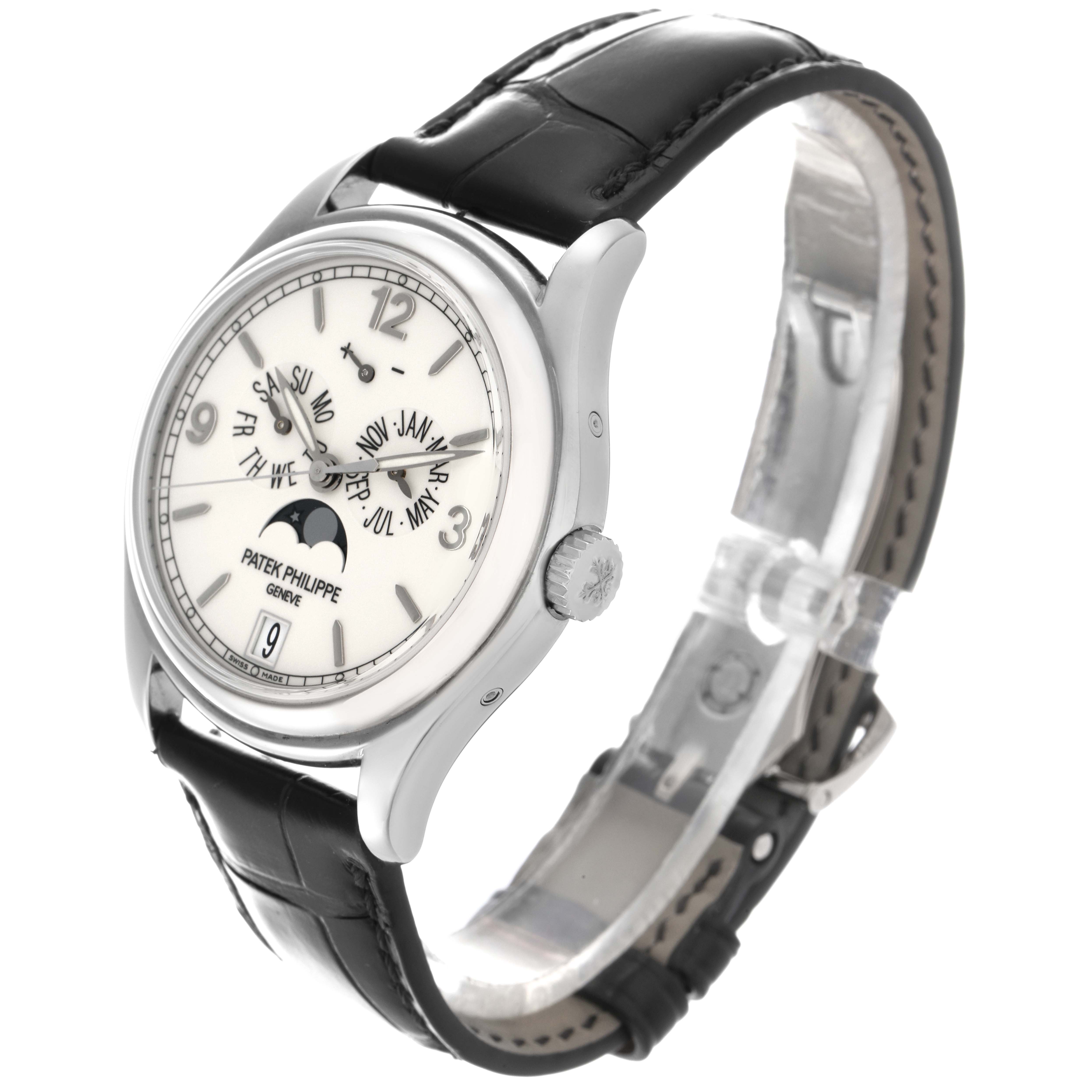 The Patek Philippe Complications 5146G Men
s White Gold White Dial 5146G Men
s White Gold White Dial watch is shown at a three-quarter angle, highlighting its face, crown, and leather strap.