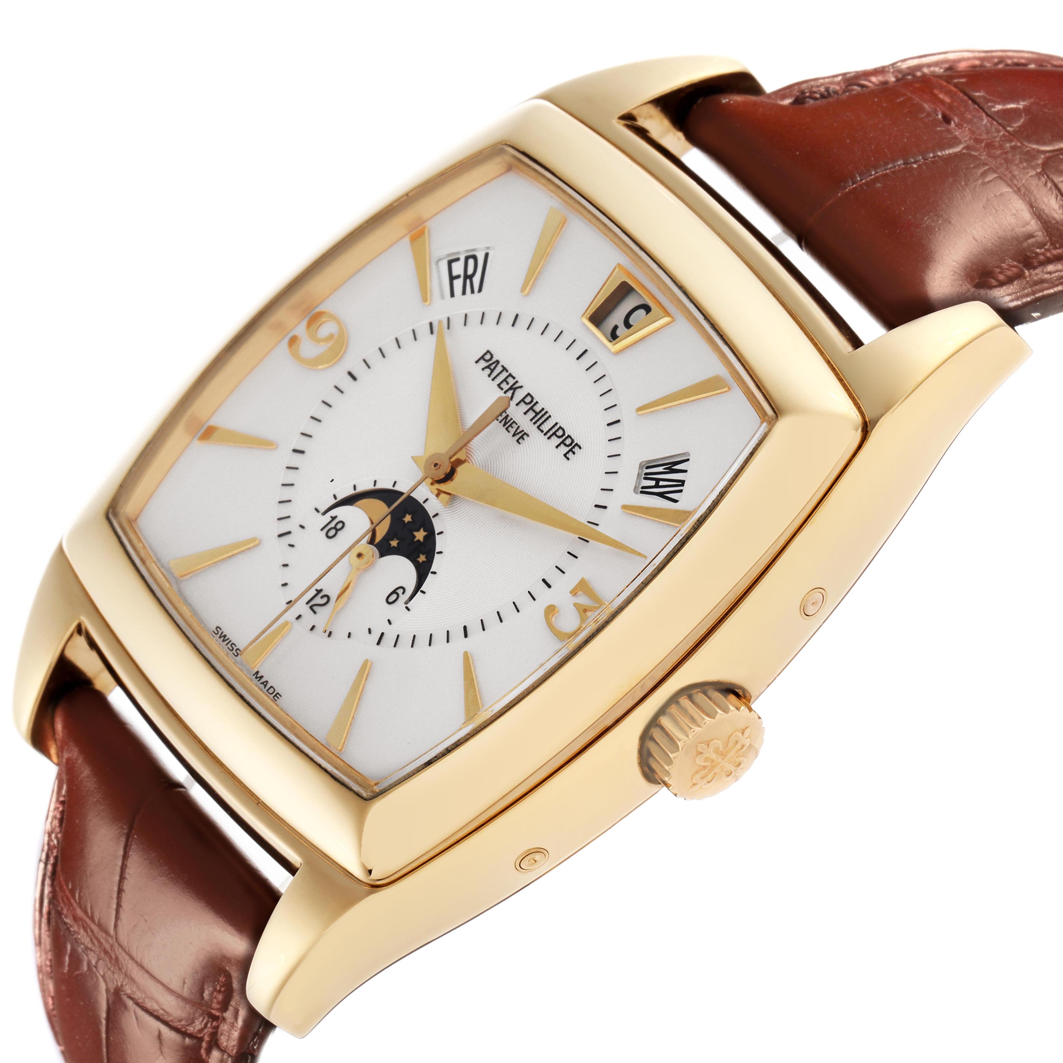 The Patek Philippe Gondolo 5135J-001 Men
s Yellow Gold White Dial 5135J-001 Men
s Yellow Gold White Dial watch is angled to show the face, crown, and leather strap, highlighting its complications and gold case.