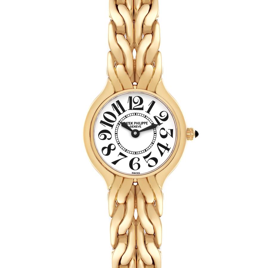 The Patek Philippe La Flamme watch is shown from a top view, highlighting its round face, large numerals, and gold bracelet.