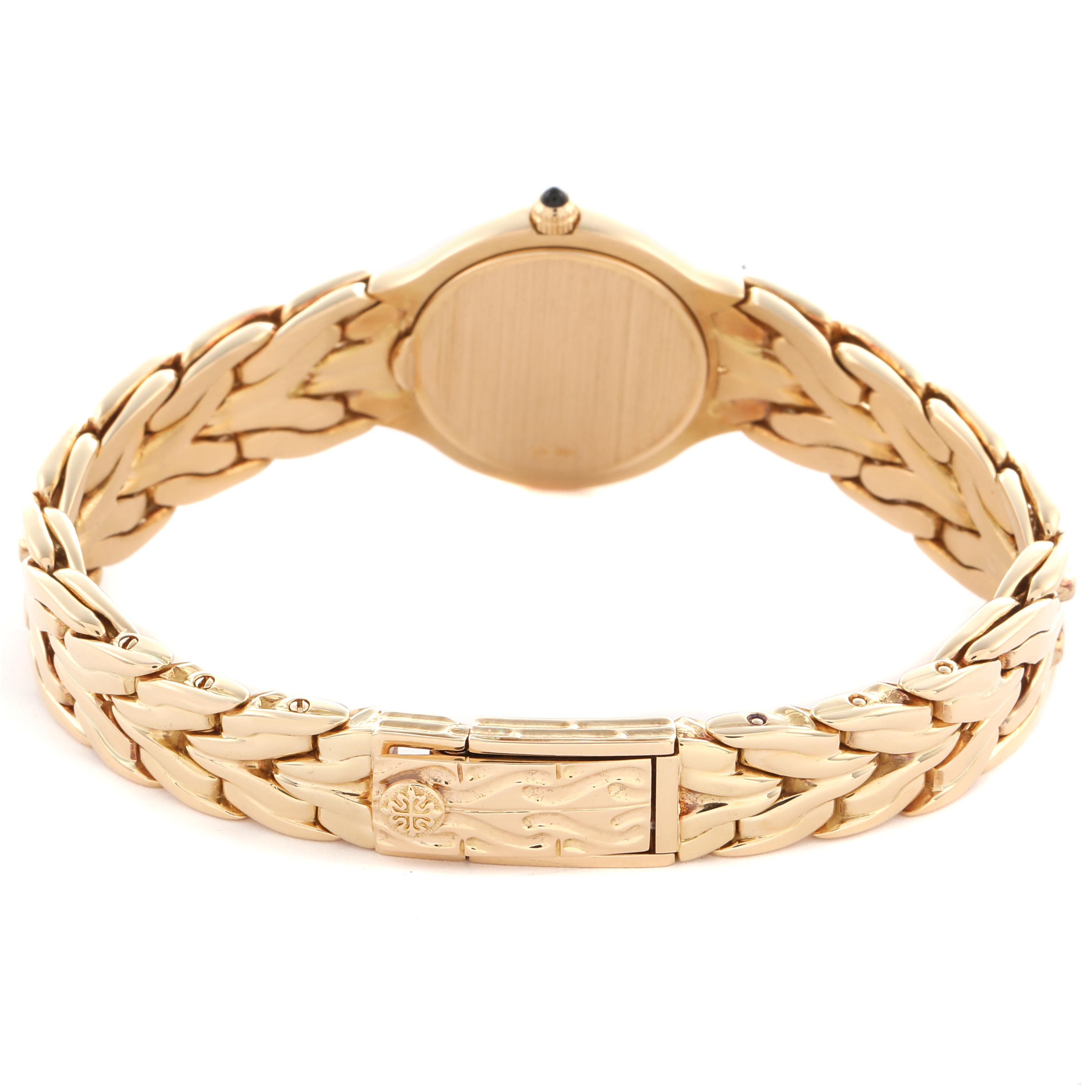 The image shows the back view of the Patek Philippe La Flamme  4816/1 Women
s Yellow Gold White Dial 4816/1 Women
s Yellow Gold White Dialwatch, focusing on the bracelet and clasp.