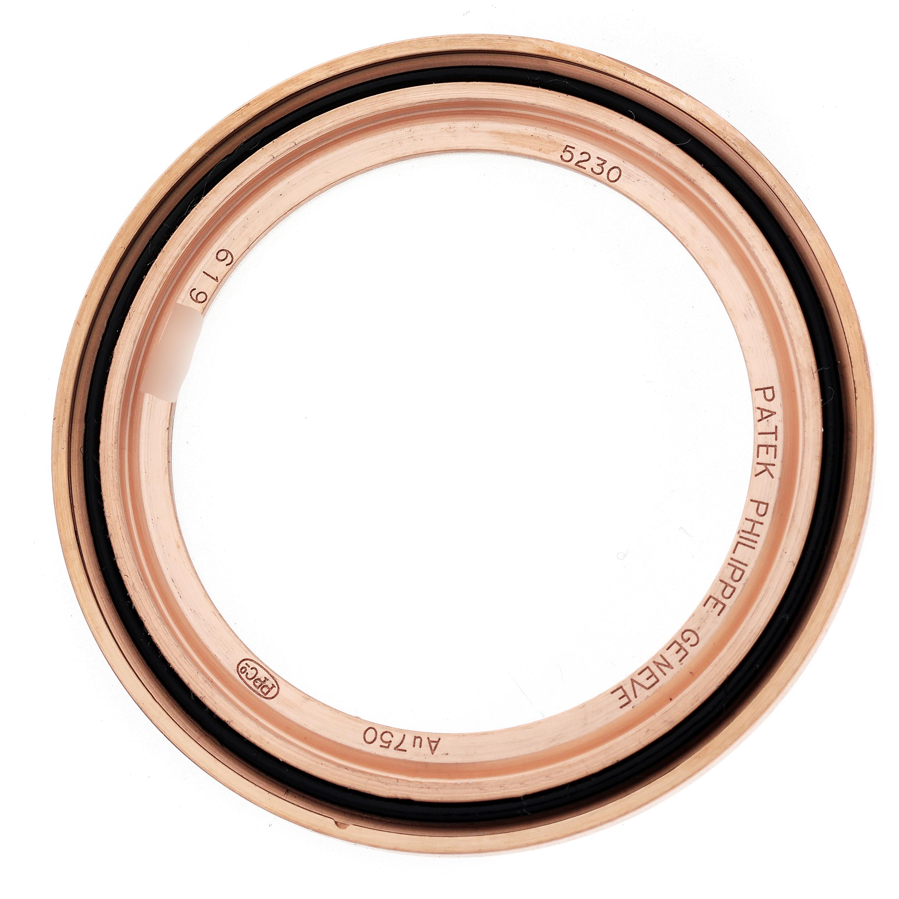 The image shows a bezel part from the Patek Philippe Complications 5230R-001 Men
s Rose Gold Grey Dial 5230R-001 Men
s Rose Gold Grey Dial model at a top-down angle.