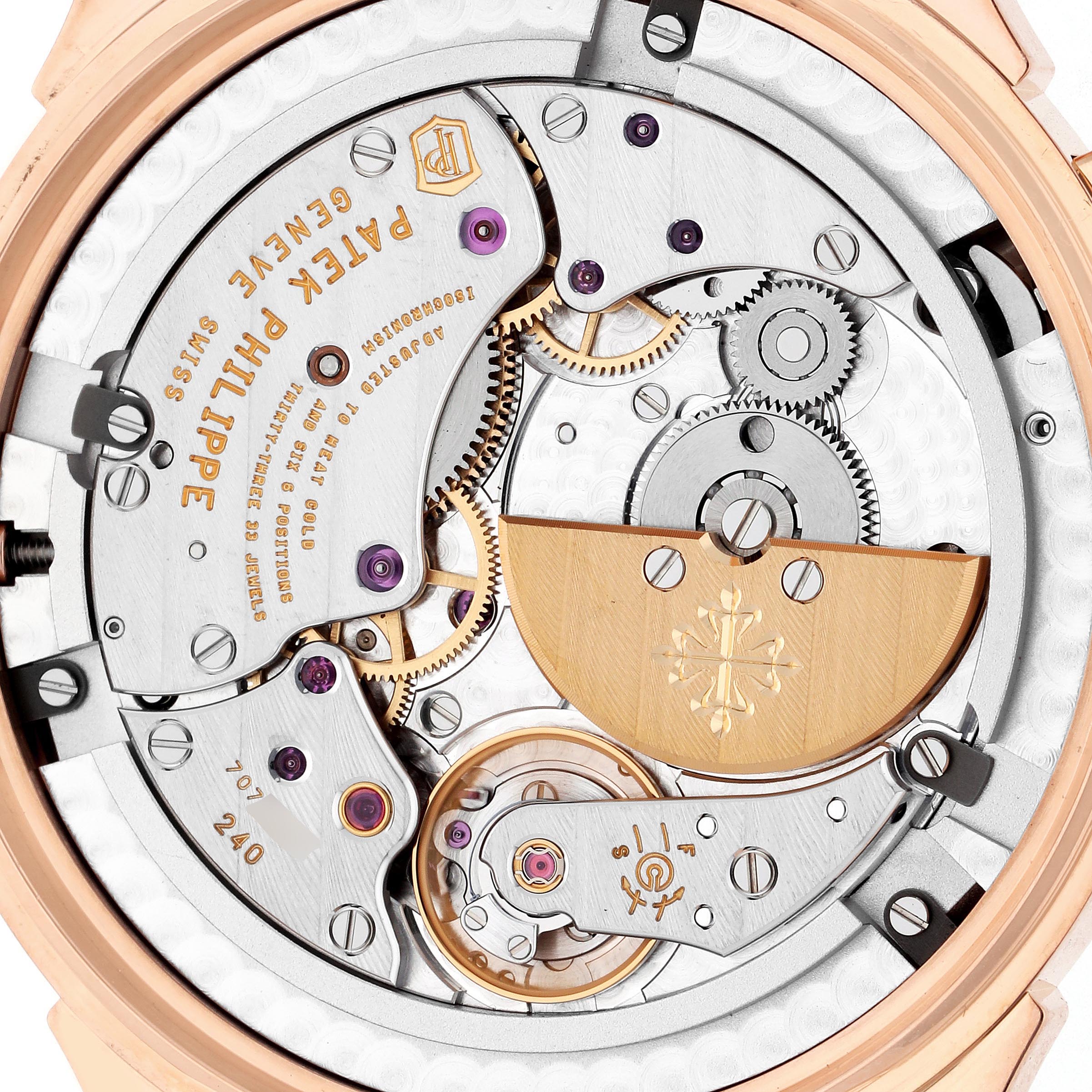 The image shows the movement and intricate mechanisms of a Patek Philippe Complications 5230R-001 Men
s Rose Gold Grey Dial 5230R-001 Men
s Rose Gold Grey Dial watch from a back or rear angle.