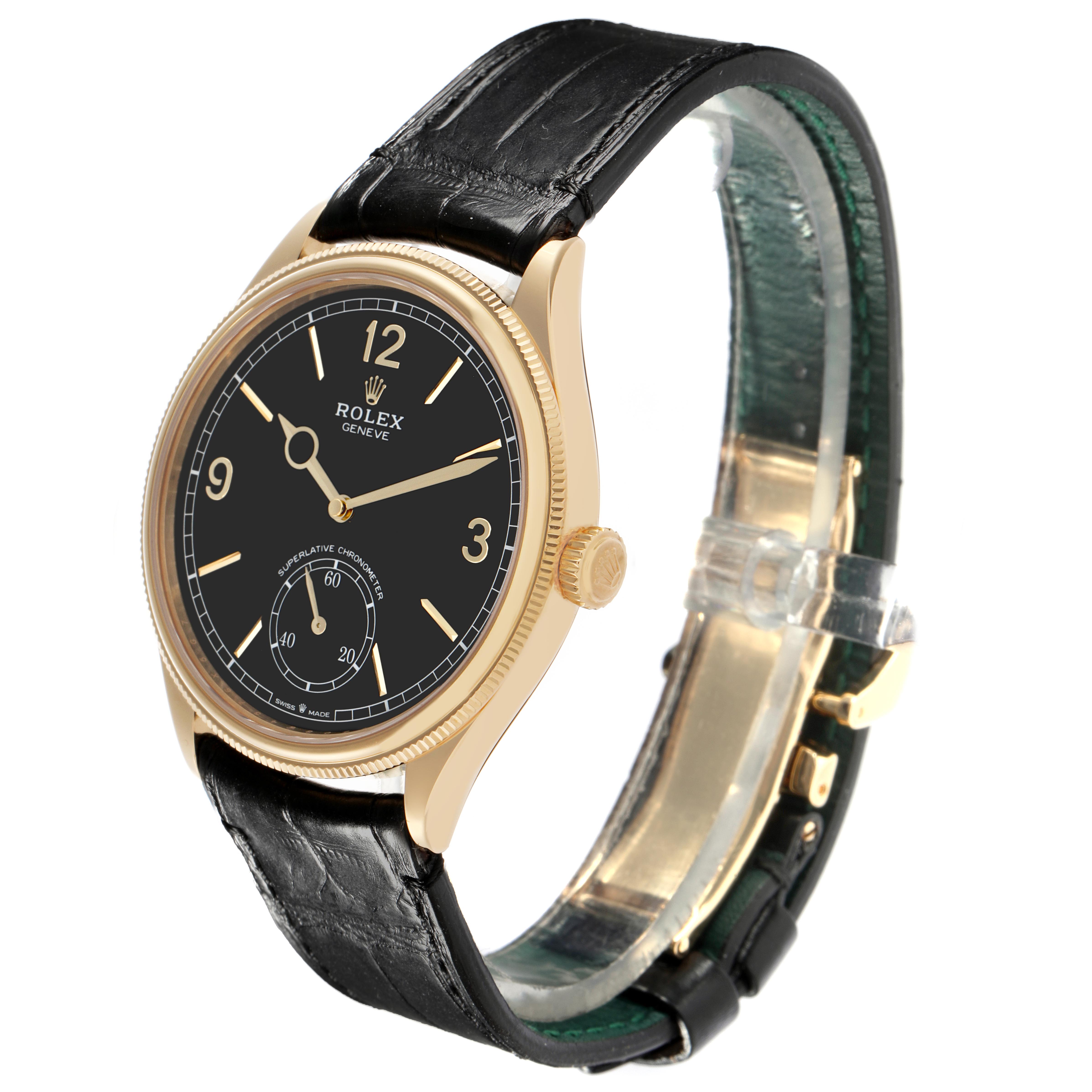 The Rolex 1908 52508-0002 Men's Yellow Gold Black Dial 52508-0002 Men's Yellow Gold Black Dial watch is shown at a three-quarter angle, displaying the dial, bezel, crown, and black leather strap.