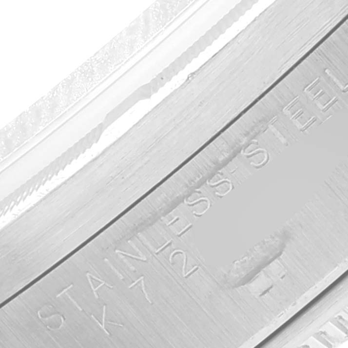 This image shows a close-up of the case back engraving of a Rolex Air-King 14010 Men's Stainless Steel Blue Dial 14010 Men's Stainless Steel Blue Dial watch, focusing on the "STAINLESS STEEL" inscription.