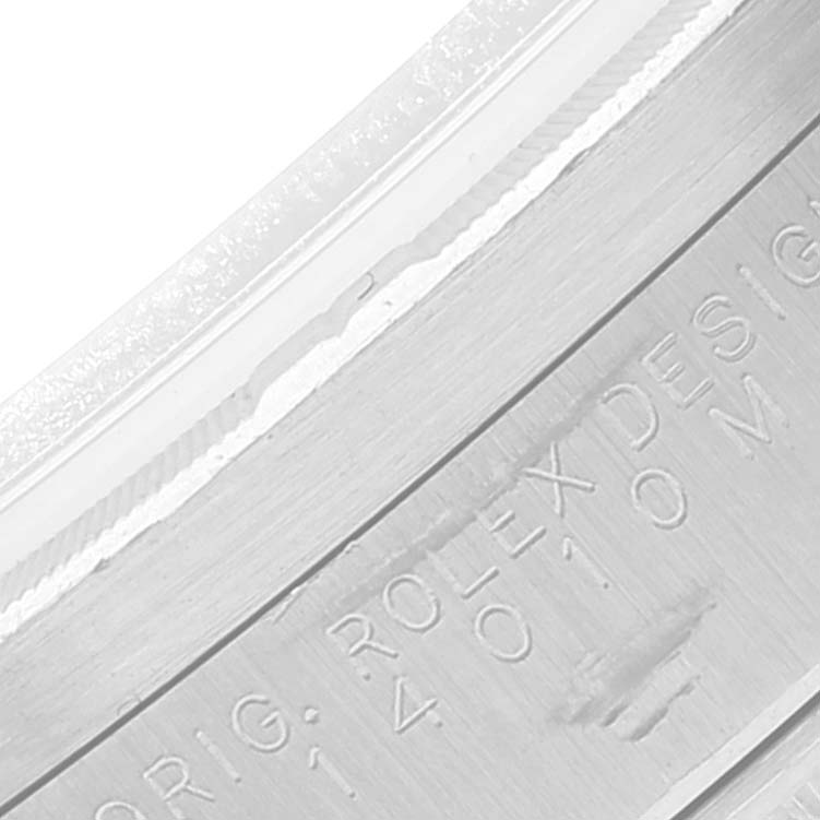 The image shows a close-up view of the engraved details on the case of a Rolex Air-King 14010 Men's Stainless Steel Blue Dial 14010 Men's Stainless Steel Blue Dial watch.