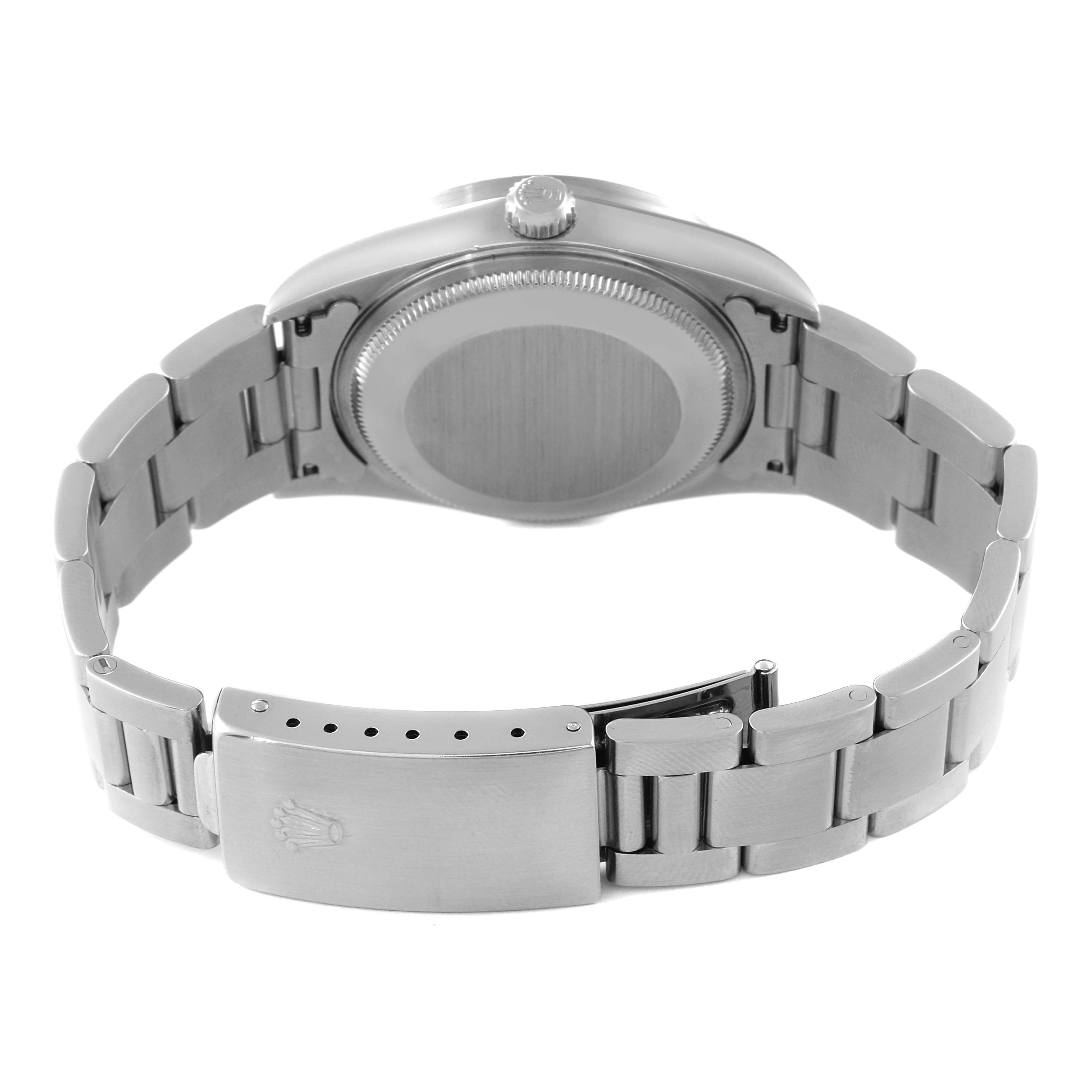 The image shows the back of a Rolex Air-King 14010 Men's Stainless Steel Blue Dial 14010 Men's Stainless Steel Blue Dial watch, focusing on the case back, crown, and metal bracelet clasp.