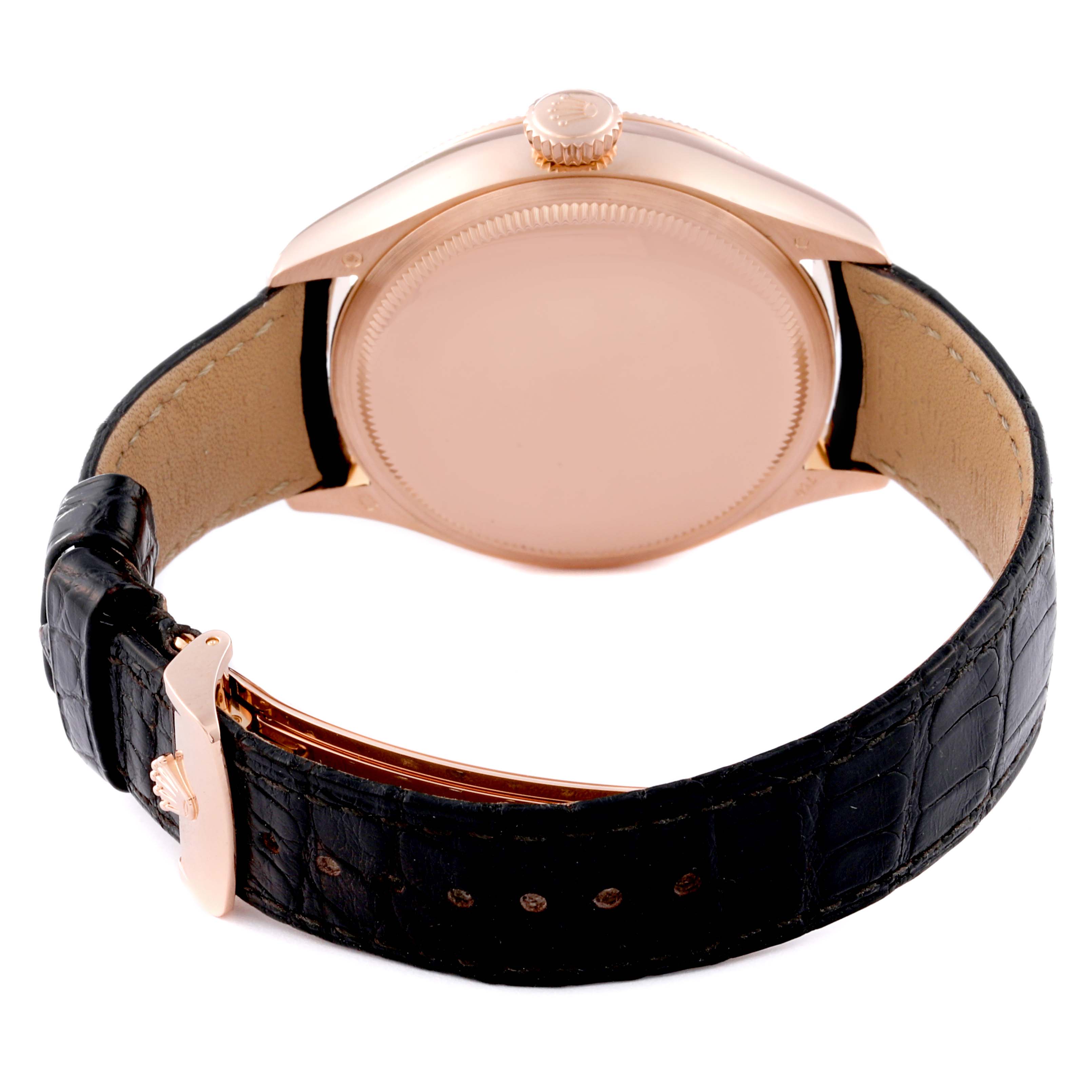 The Rolex Cellini 50535 Men
s Rose Gold White Dial 50535 Men
s Rose Gold White Dial watch is shown from the back, featuring the case, crown, and black leather strap with a clasp.