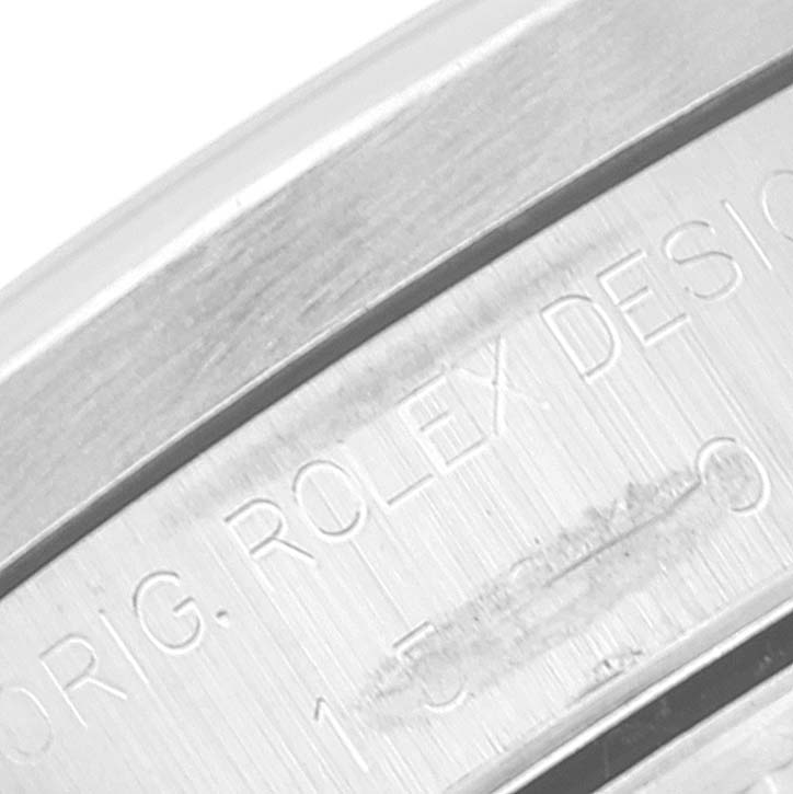 This close-up image showcases the engraved Rolex branding on the case of a Rolex Date 15210 Men's Stainless Steel Silver Dial 15210 Men's Stainless Steel Silver Dial model watch.