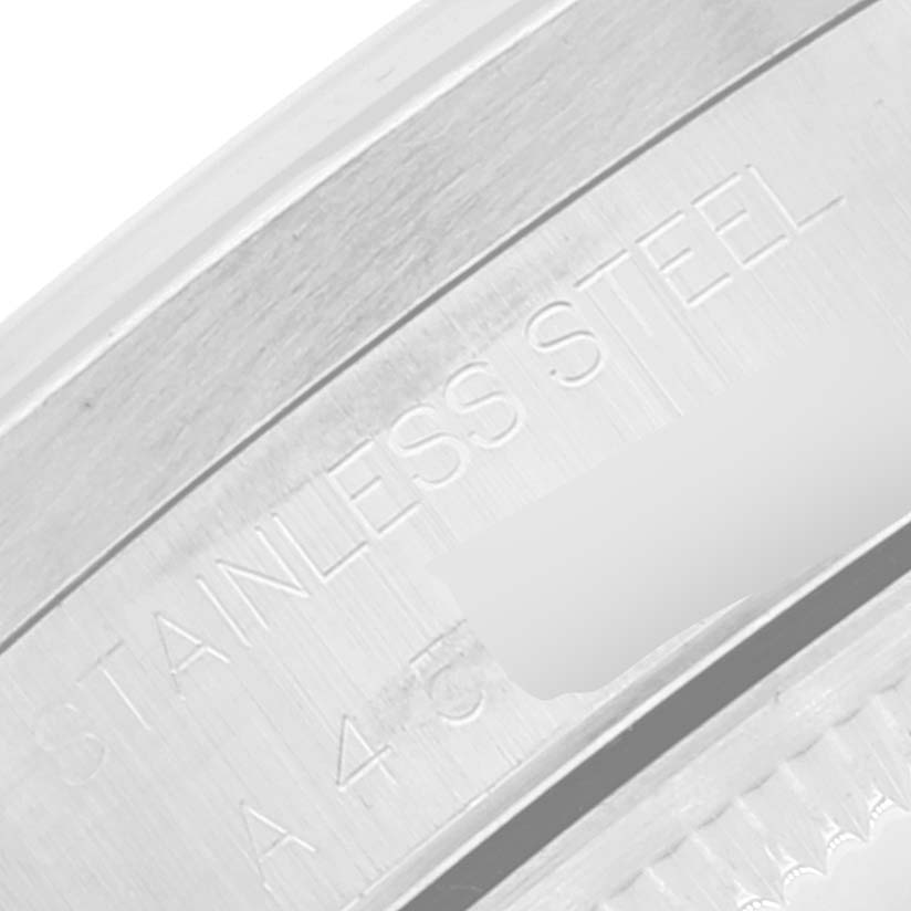 This image shows a close-up of the stainless steel casing and inscription on a Rolex Date 15210 Men's Stainless Steel Silver Dial 15210 Men's Stainless Steel Silver Dial model watch.