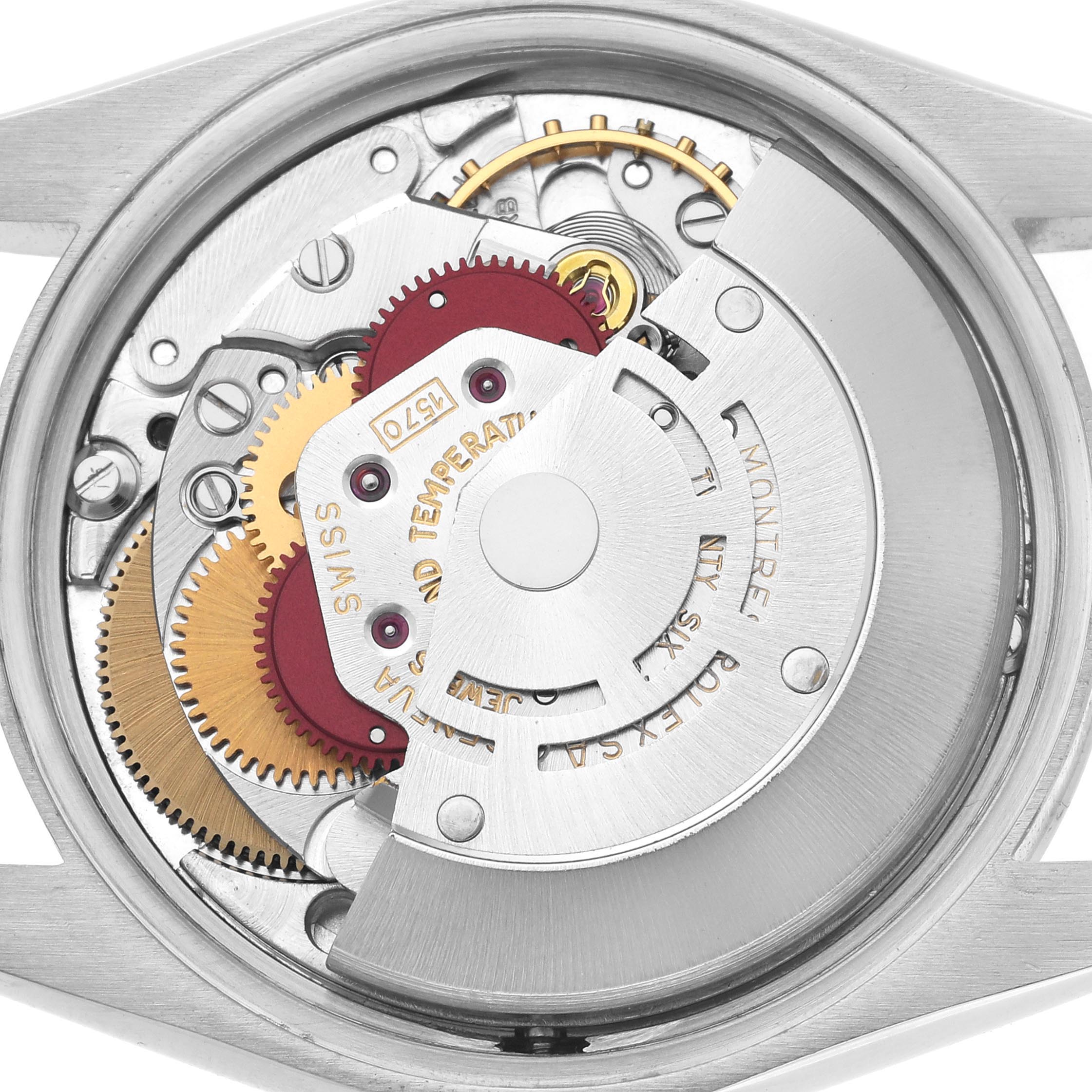 The image shows the movement of a Rolex Date watch, highlighting gears and the rotor from a top-down angle.